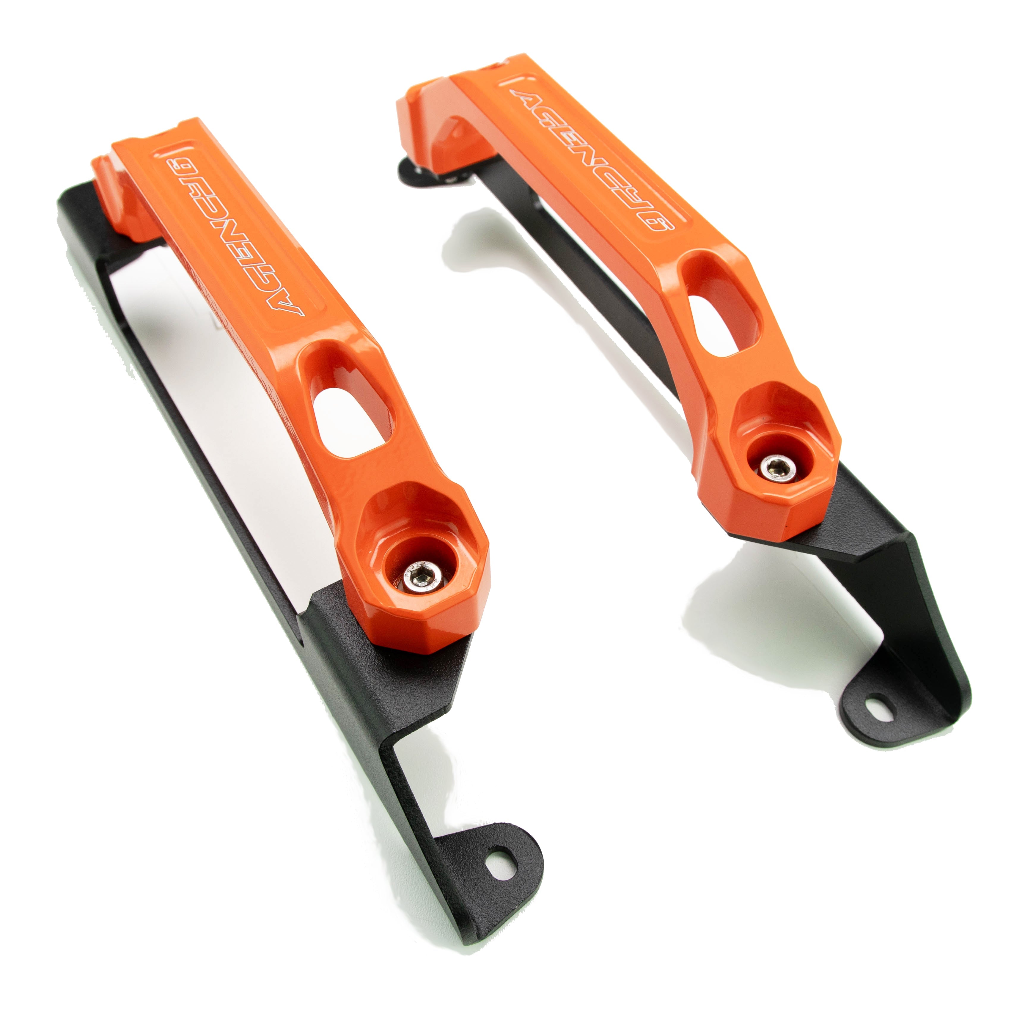 Pair of orange billet aluminum automotive mounting brackets with black metal bases