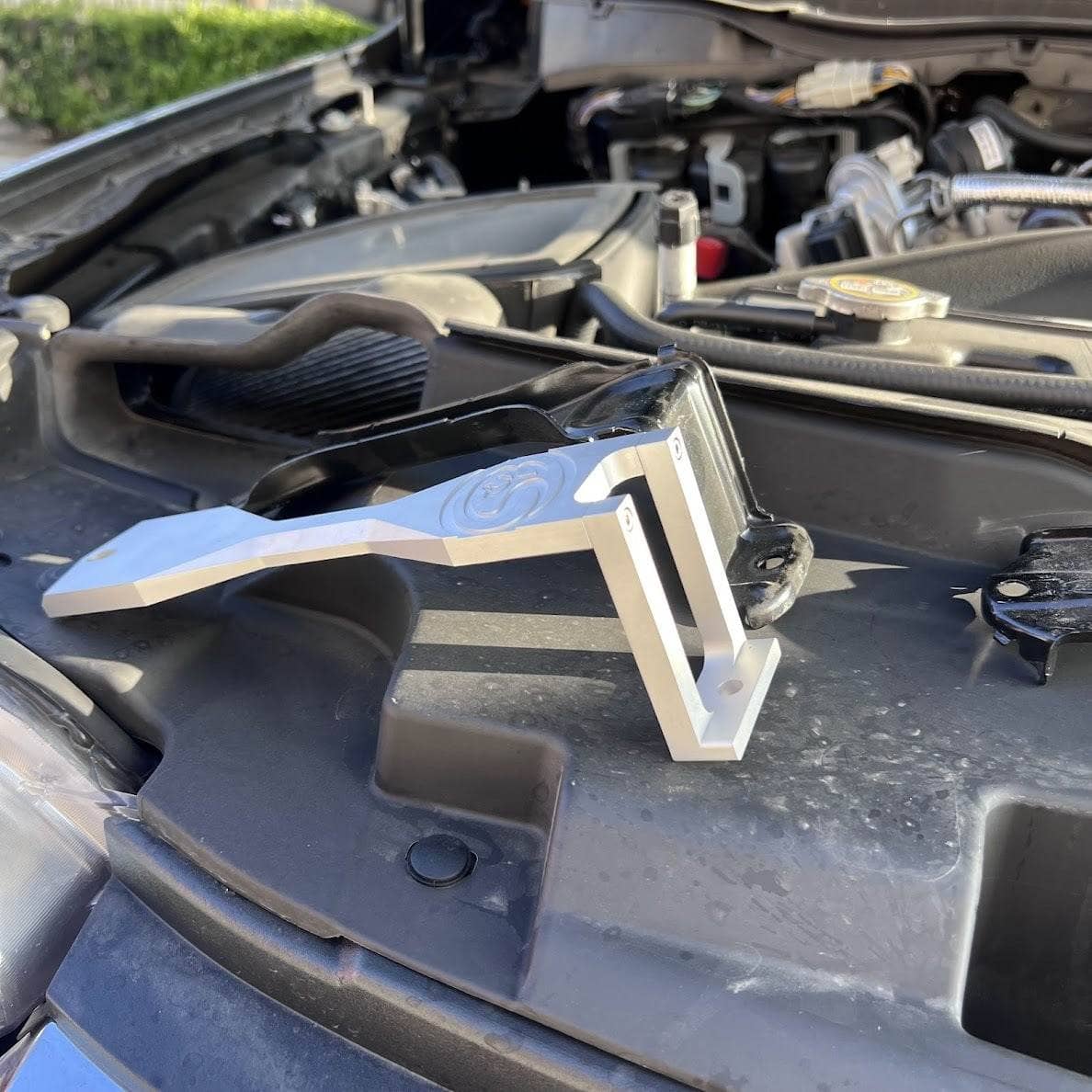 S&B billet battery hold-down brackets for 2011-2022 Ford Super Duty 6.7L