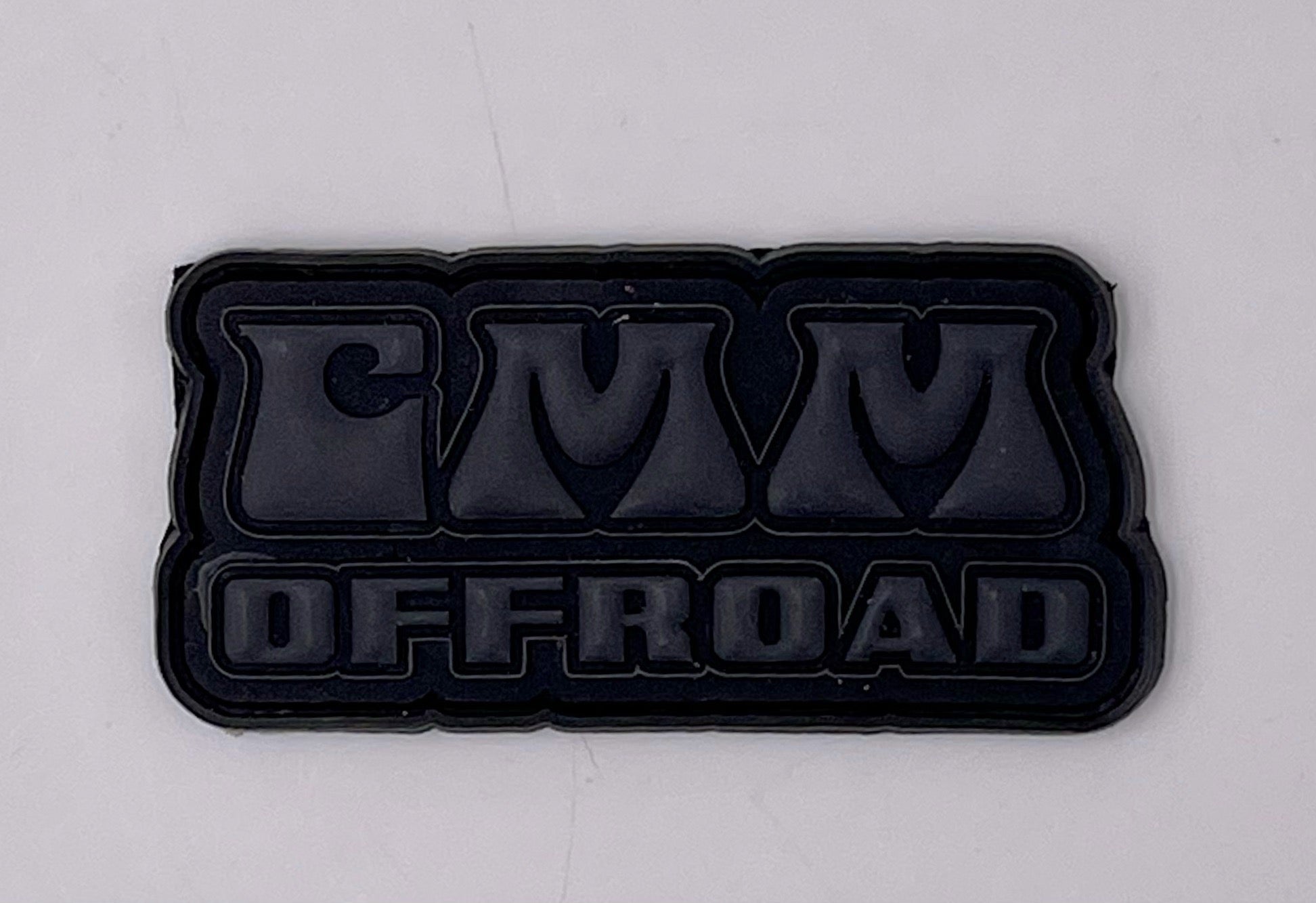CMM Offroad black rubber patch with bold lettering for overlanding or vehicle accessory use