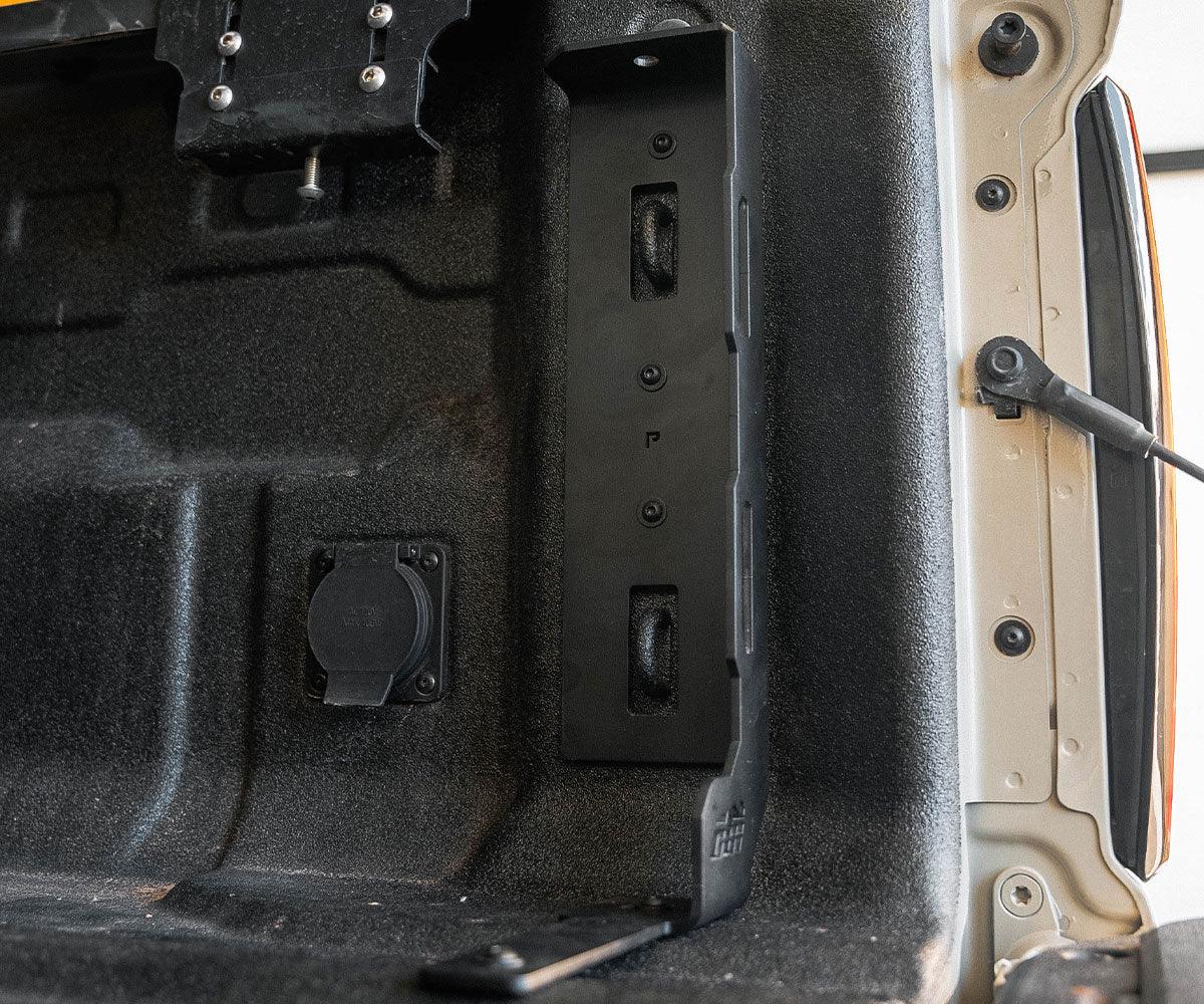 Truck bed stiffener installed on tailgate of Toyota Tacoma for off-road support