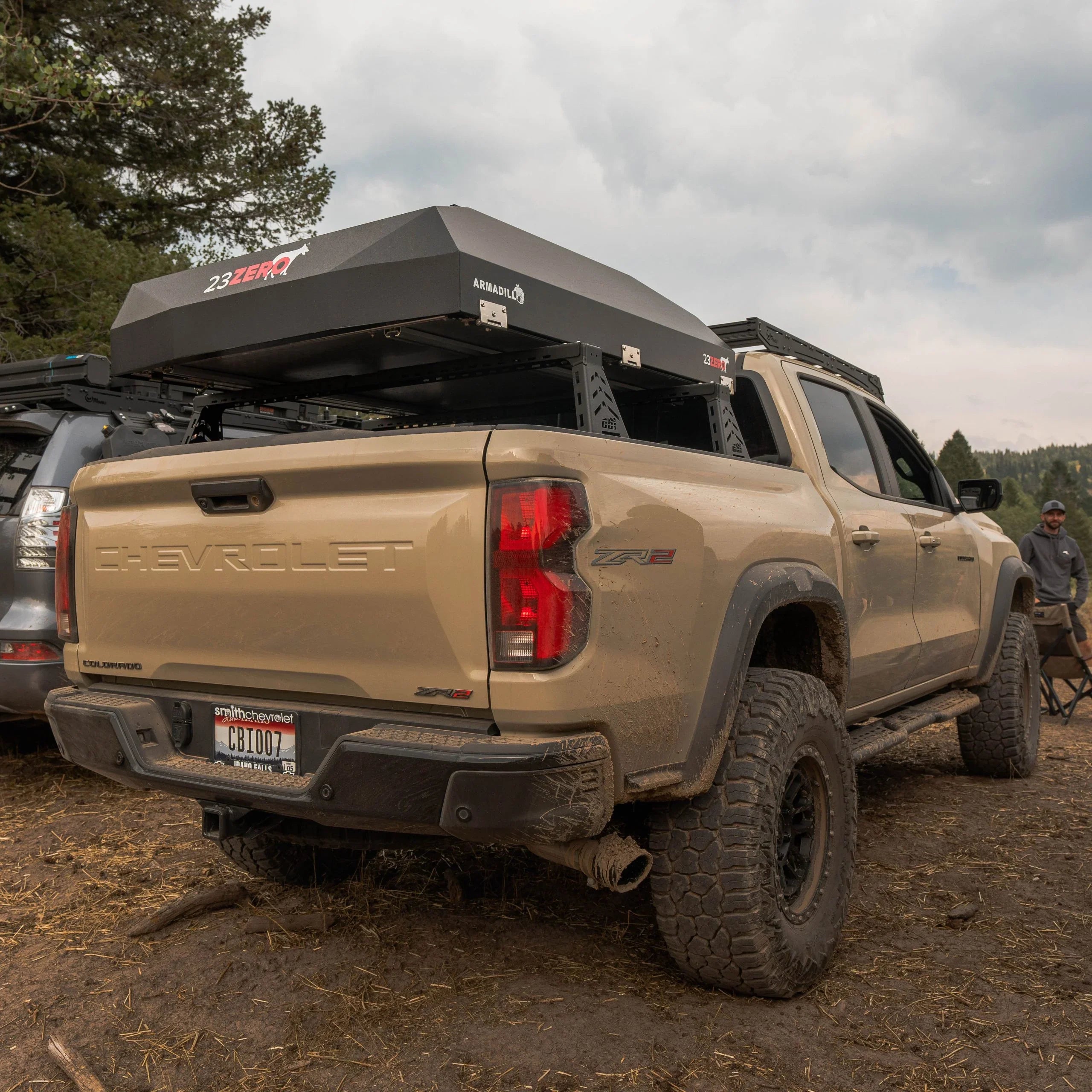 Chevrolet Colorado ZR2 with roof top tent and off-road accessories at outdoor campsite