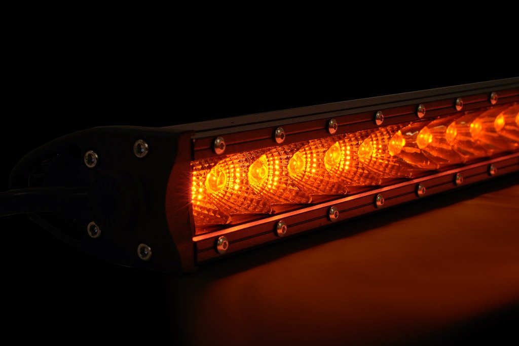 Amber LED light bar for off-road vehicles, close-up, illuminated in dark setting