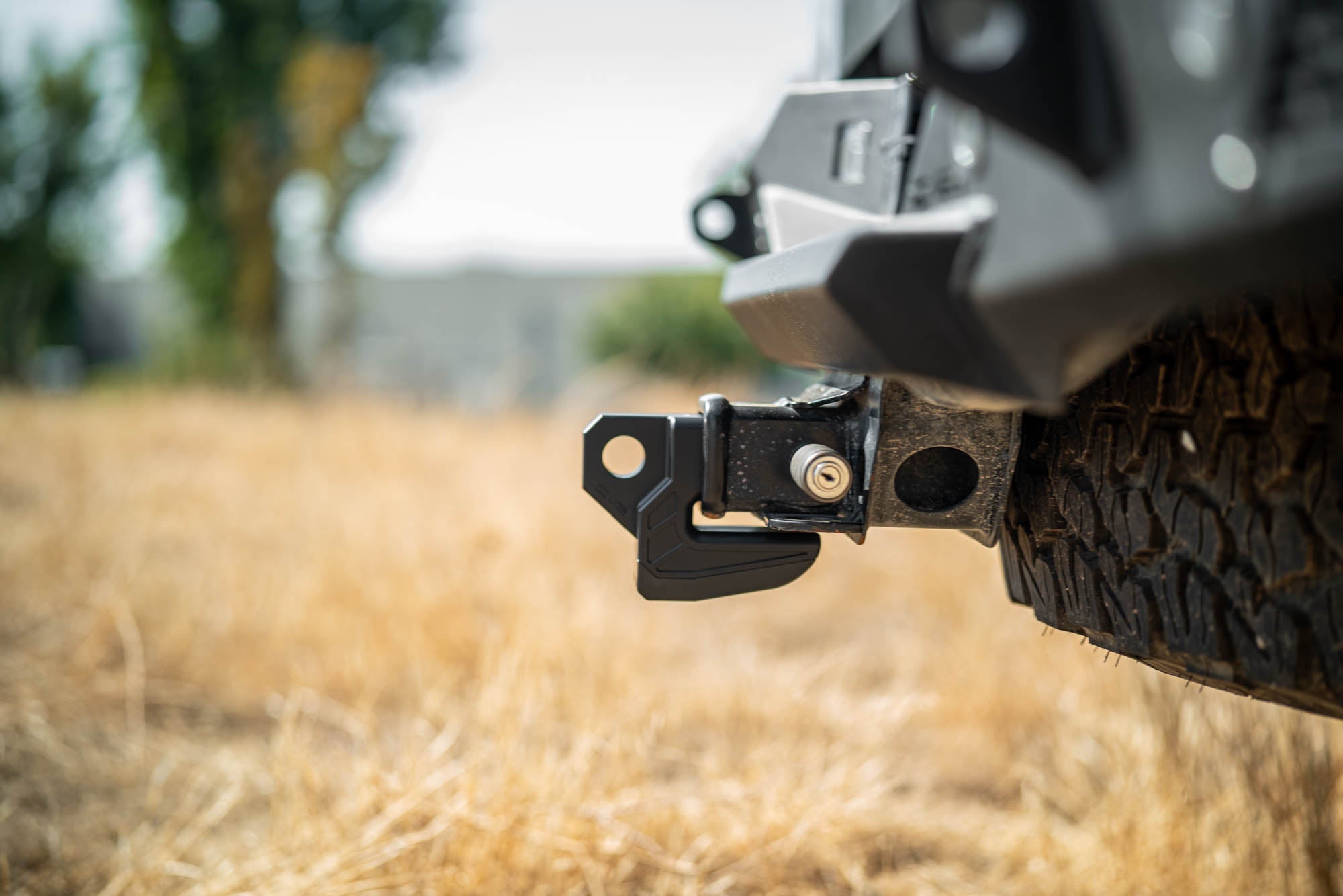 DV8-Xtract-Hitch-Skid-Plate-Black-Installed-1 - NVMOS
