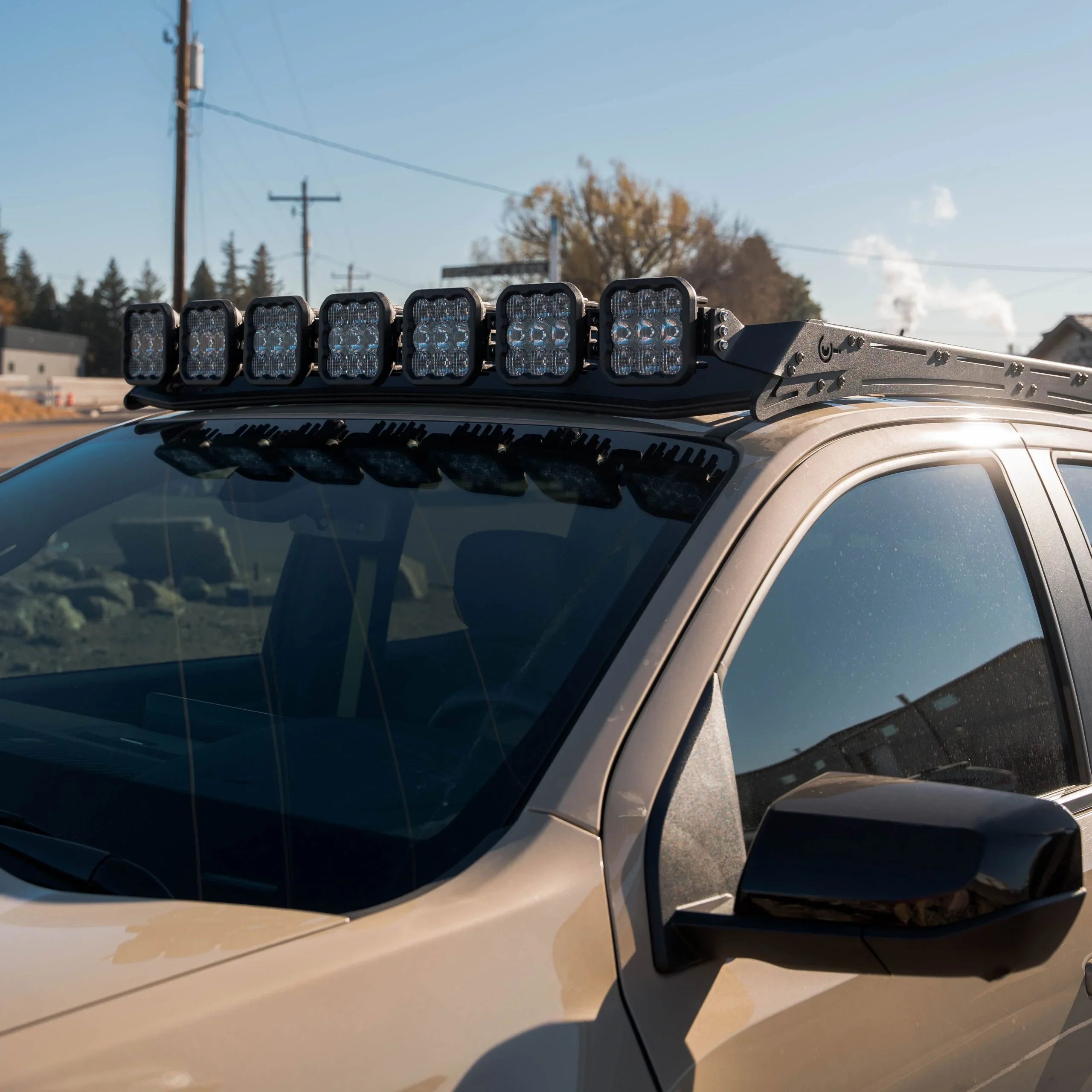 Off-road SUV with roof rack LED light bar installed, ideal for overlanding and camping