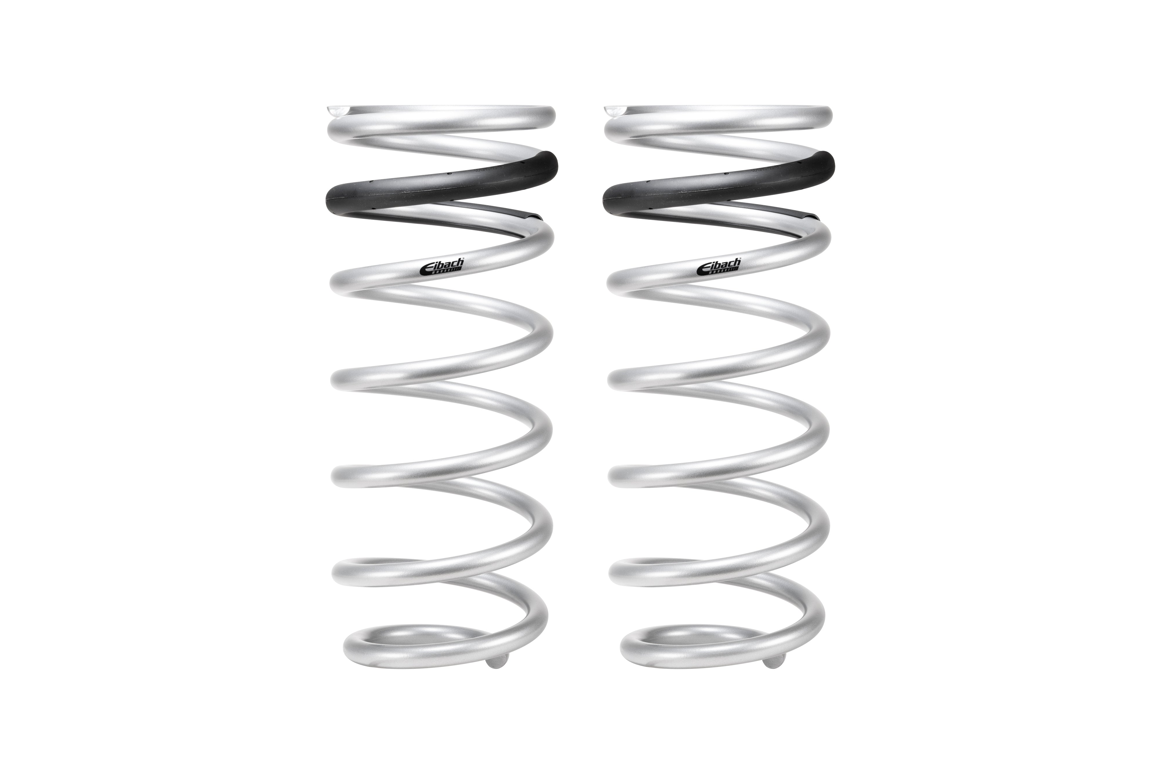 Pair of silver coil springs with black accents for off-road vehicle suspension upgrades