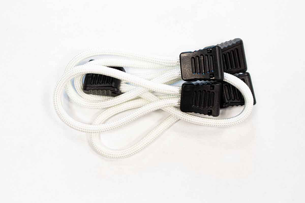 White elastic bungee cords with black plastic hooks for camping or vehicle organization