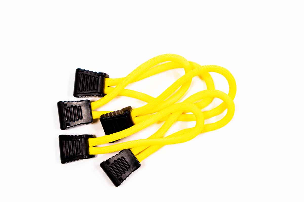 Set of yellow utility bungee cords with black plastic hooks for camping or overlanding gear