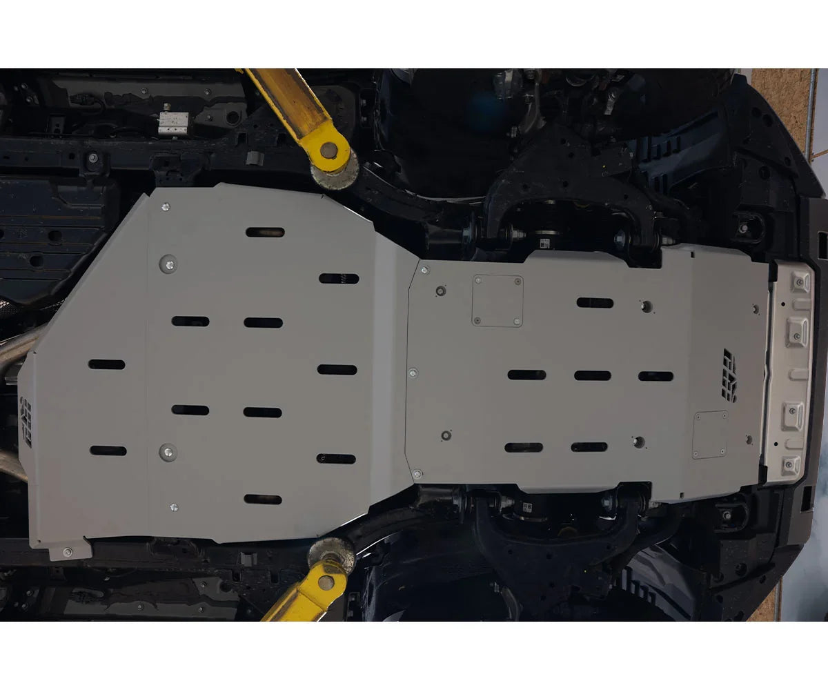 Heavy-duty skid plate installed under vehicle chassis for off-road protection
