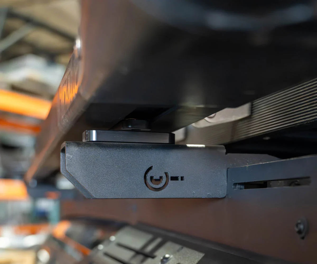 Close-up of a black metal roof rack mount for off-road vehicle overlanding gear