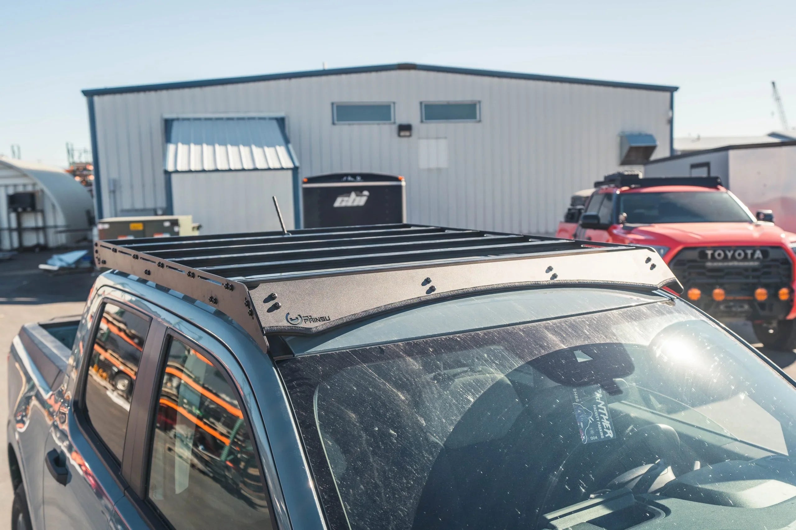 Ford Maverick with Prinsu roof rack in outdoor parking lot, overlanding accessory installed