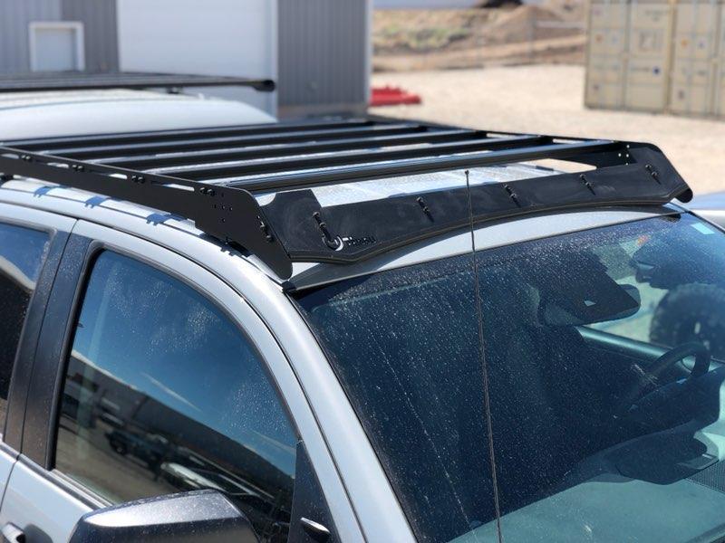Aluminum roof rack installed on a silver SUV for overlanding and camping gear transport