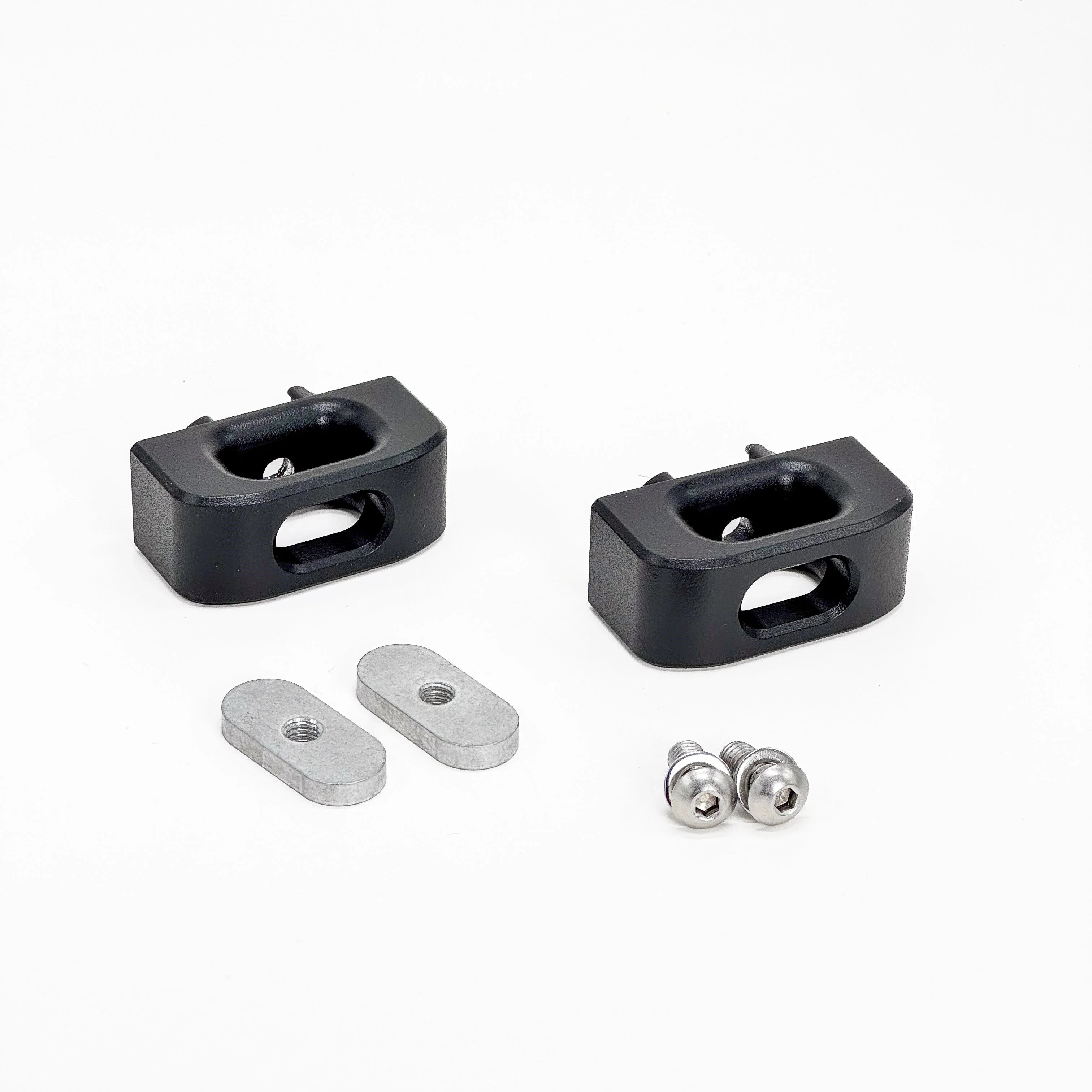 Black mounting brackets with screws and metal plates for overlanding vehicle accessories