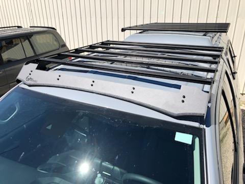 Aluminum roof rack with crossbars installed on a Toyota 4Runner, outdoor setting