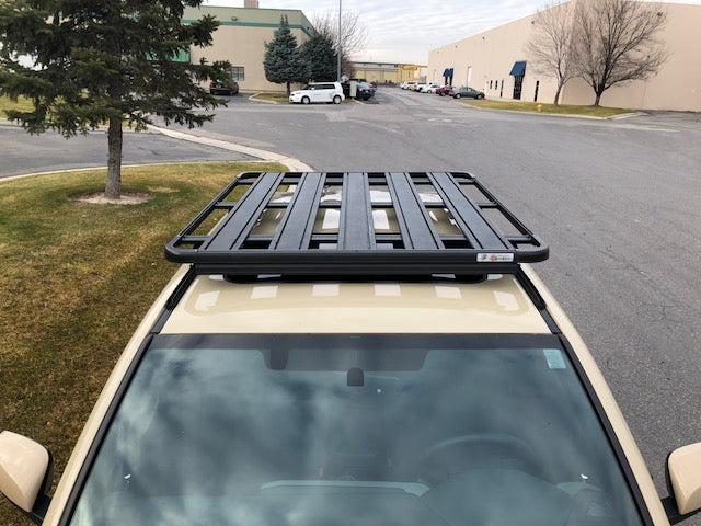 Toyota 4Runner with black roof rack platform for overlanding and camping gear