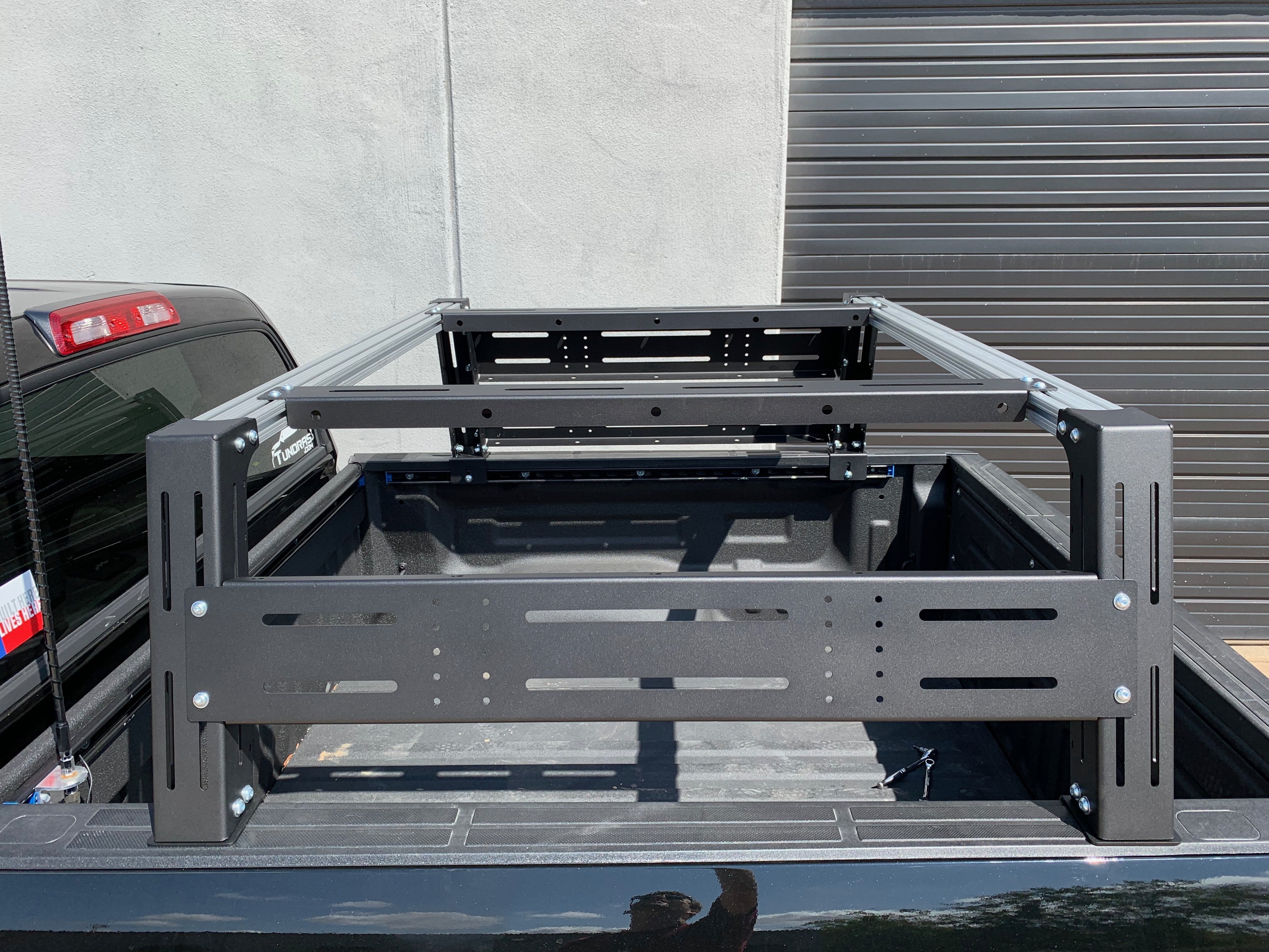 Adjustable black overland bed rack installed on a Toyota Tundra truck bed