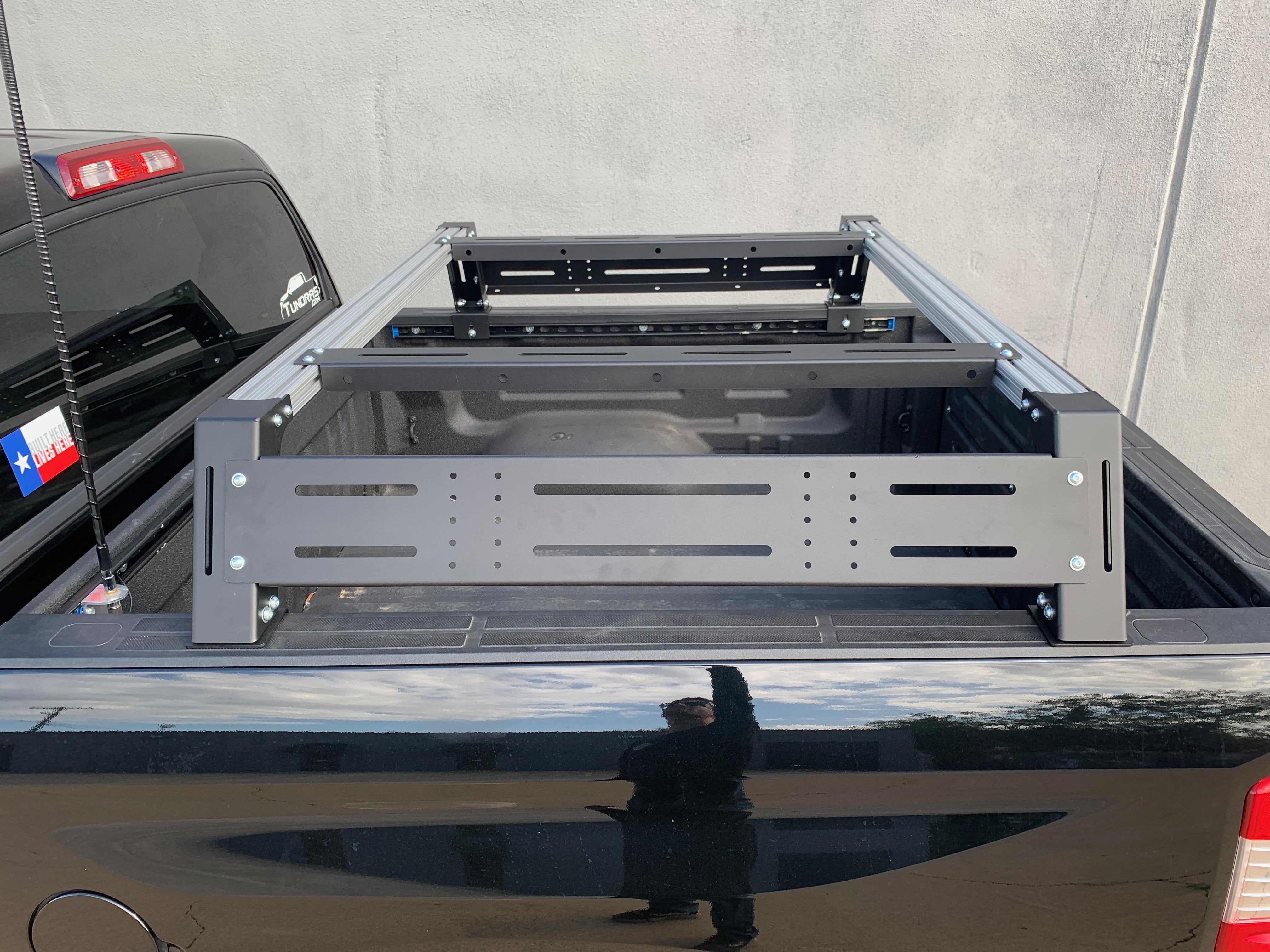 Toyota Tacoma truck bed with modular overland rack and adventure gear mounting system