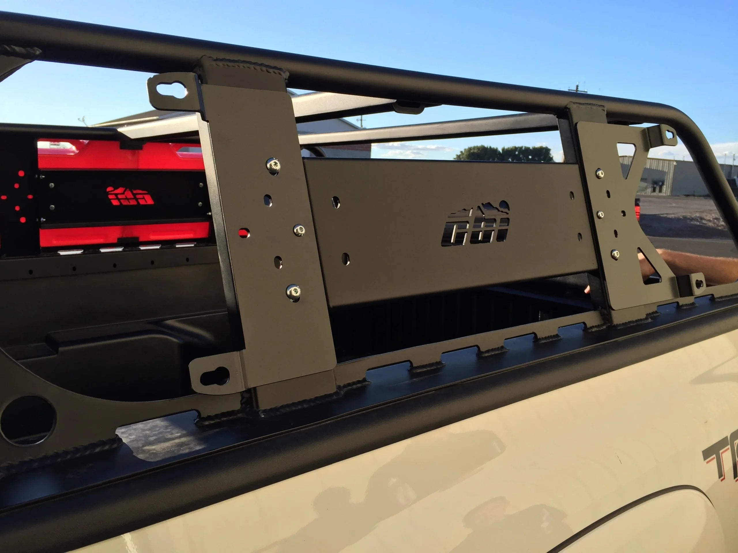 Overland bed rack installed on pickup truck, ideal for camping and off-road gear mounting
