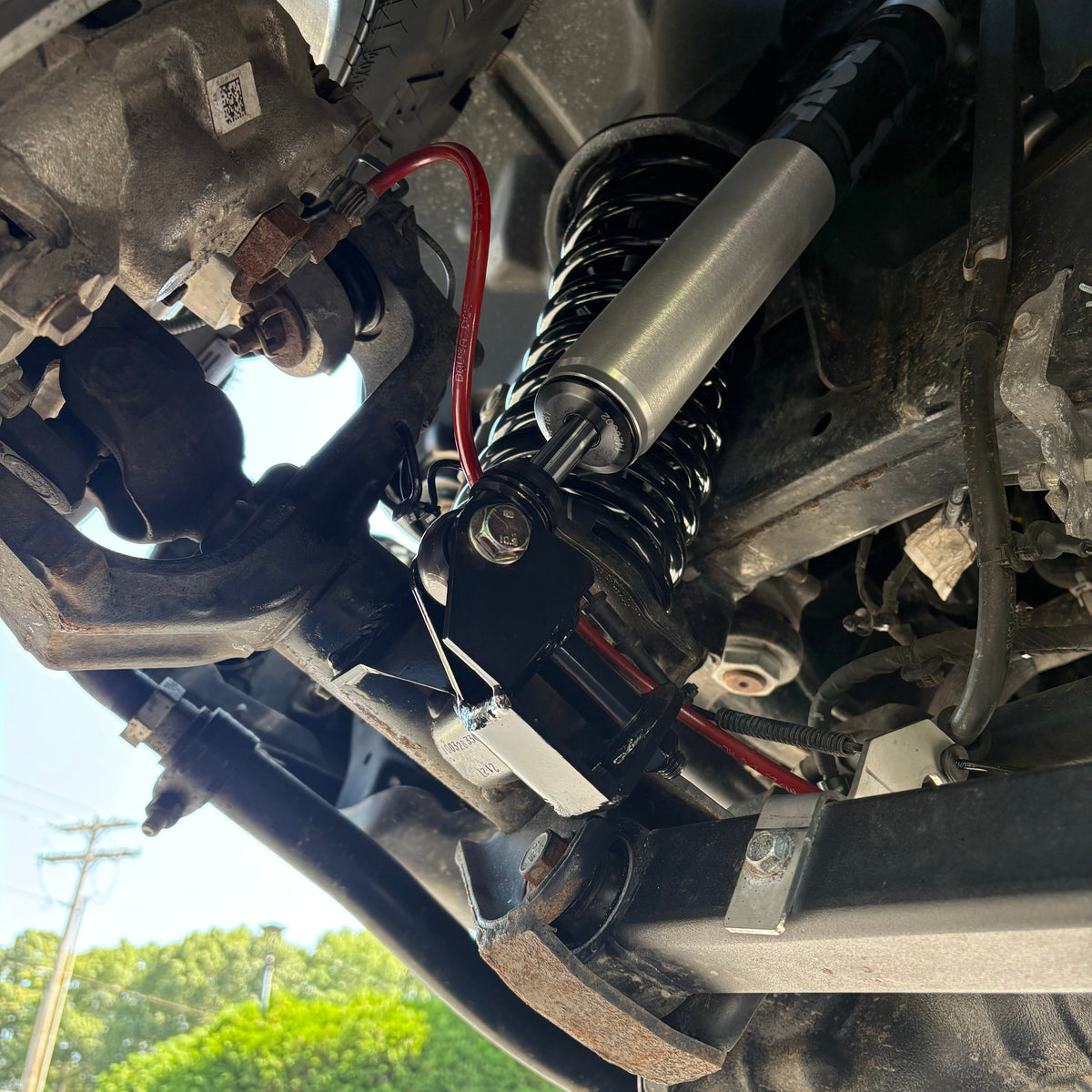 Clayton Off Road front lower shock relocation bracket for Jeep Wrangler JL and Gladiator JT