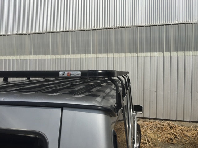 Heavy-duty roof rack mounted on silver Toyota 4Runner for overlanding and camping gear