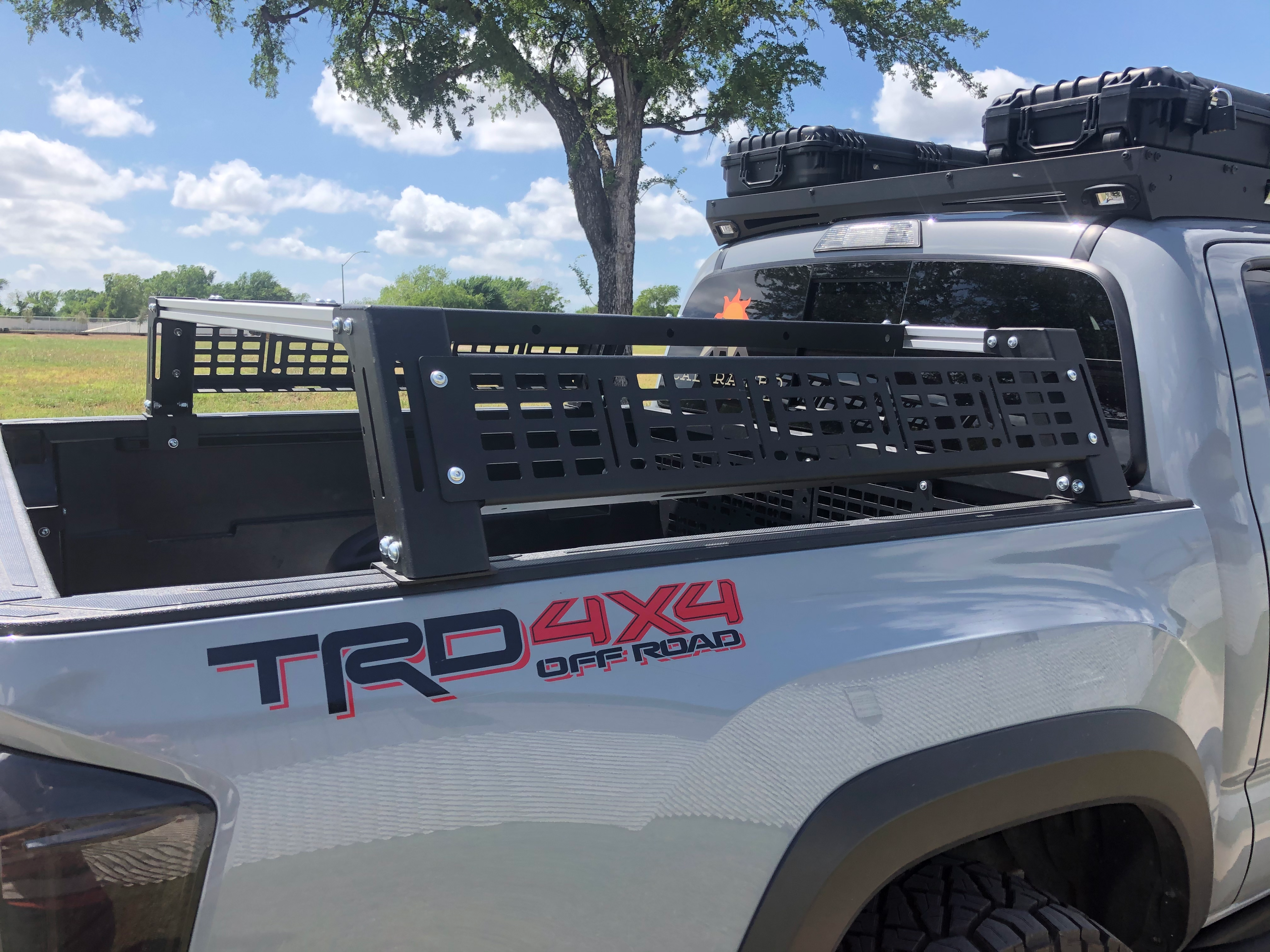 Toyota Tacoma TRD 4x4 with modular bed rack and roof storage cases for overlanding