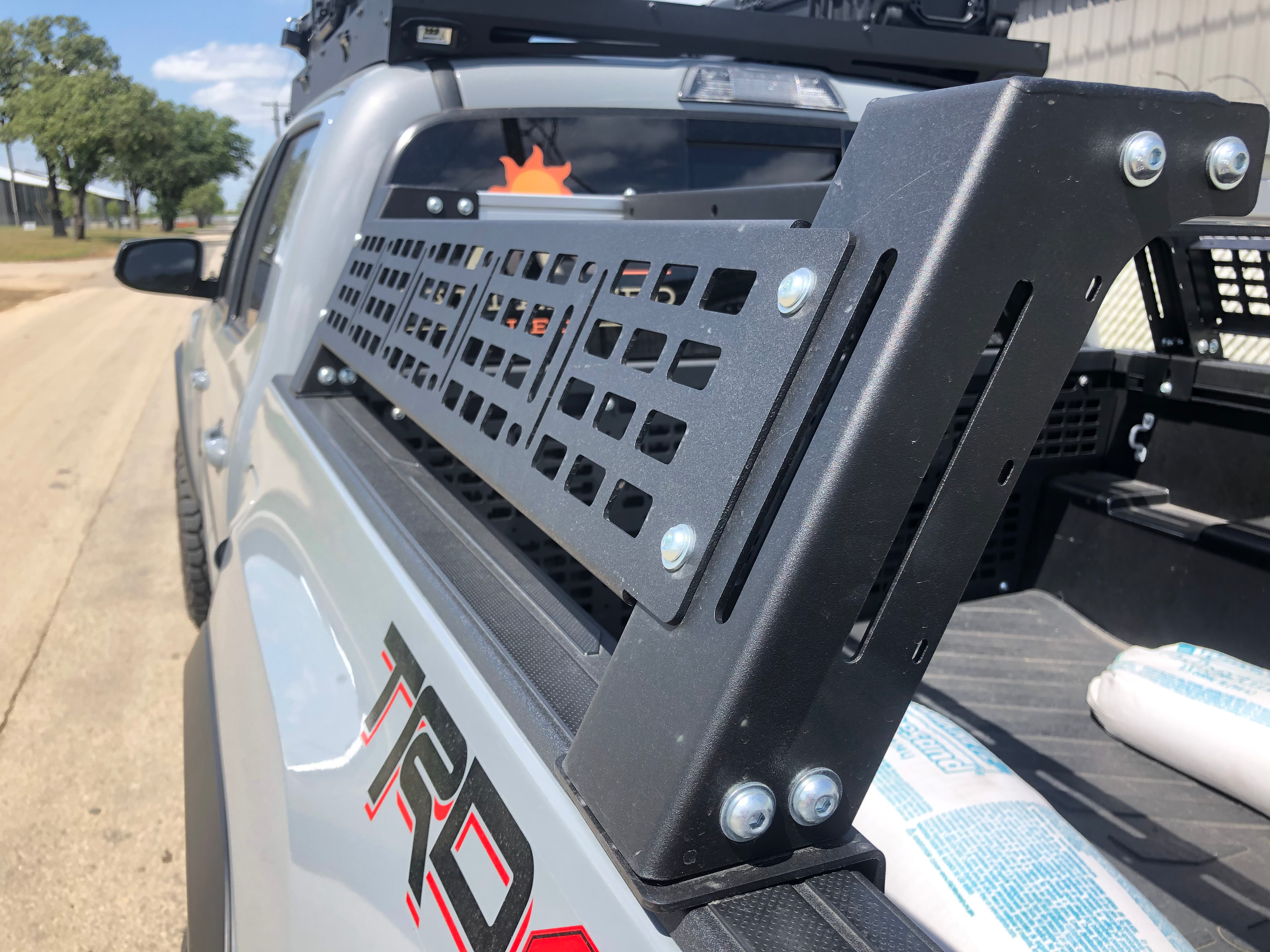 Modular bed rack accessory mounted on Toyota Tacoma for overlanding gear storage