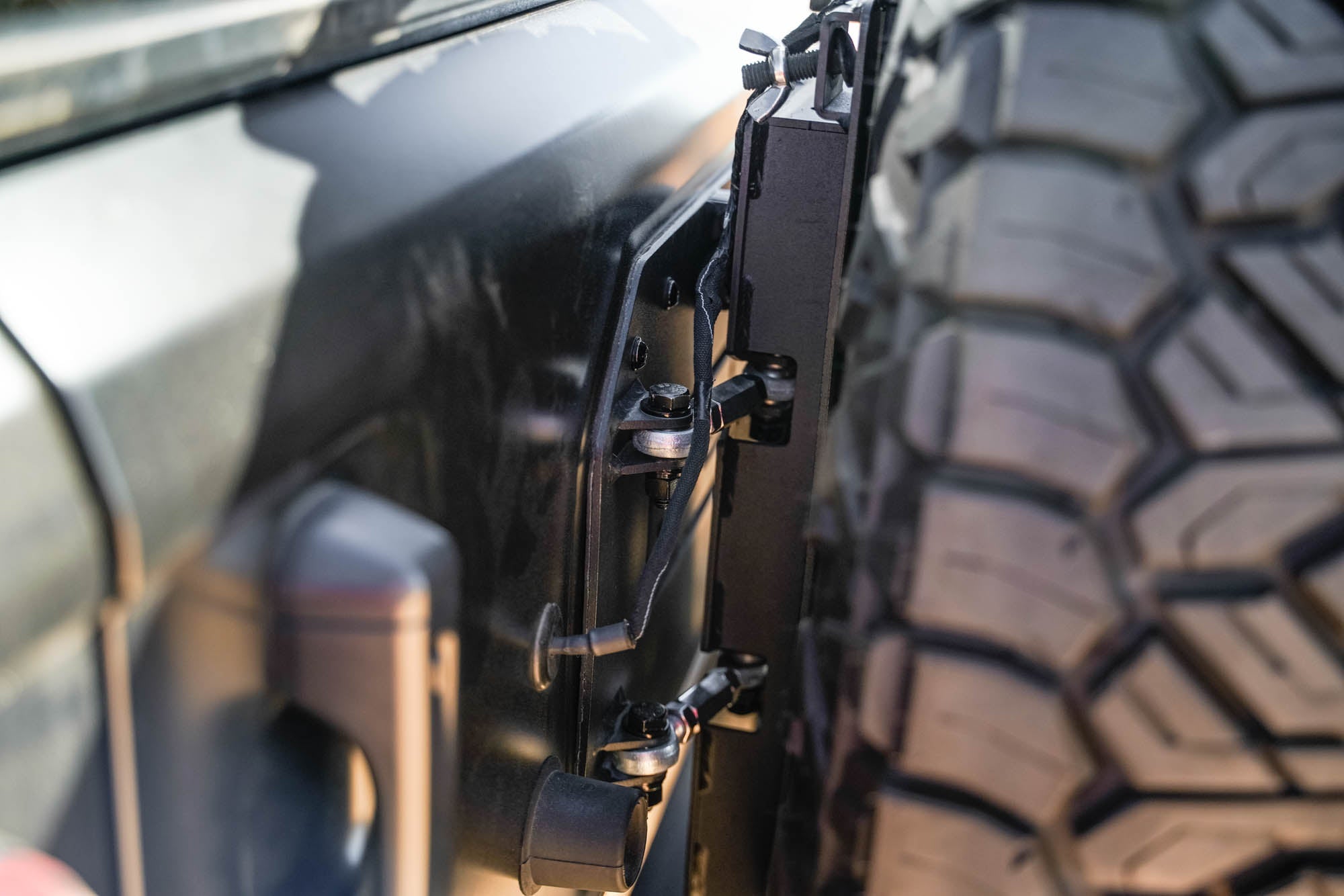 Jeep-JL-Bumper-Mounted-Tire-Carrier_Installed-03 - NVMOS