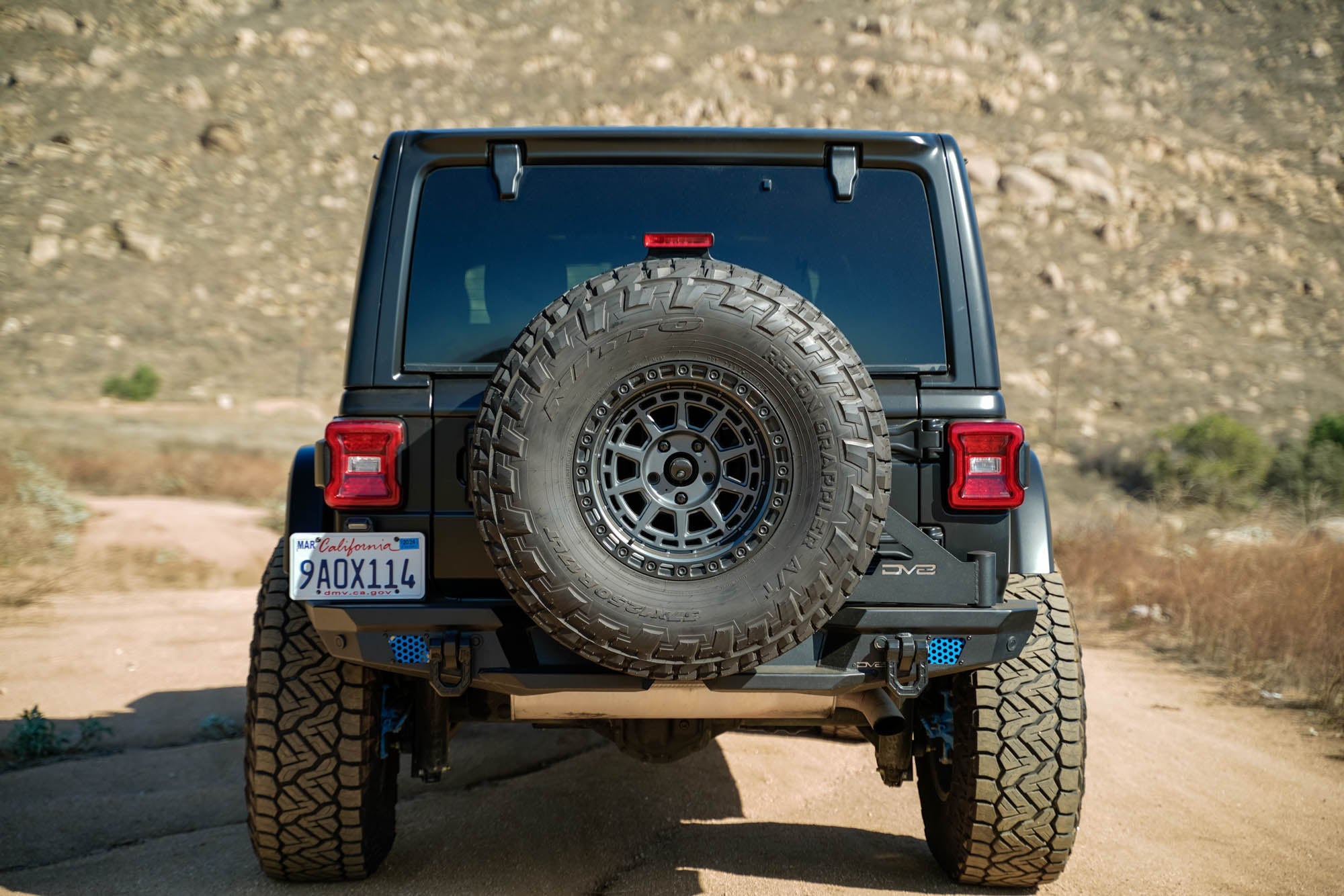 Jeep-JL-Bumper-Mounted-Tire-Carrier_Installed-04_d1dd8e0e-6728-4019-986c-cb532910bb2f - NVMOS