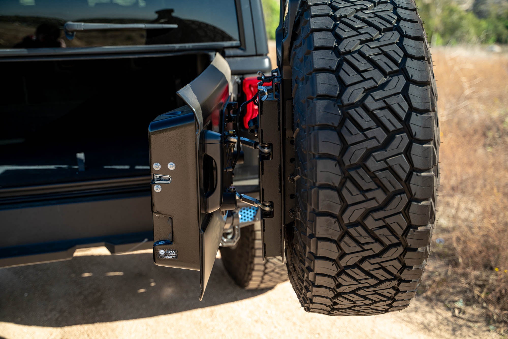 Jeep-JL-Bumper-Mounted-Tire-Carrier_Installed-07 - NVMOS