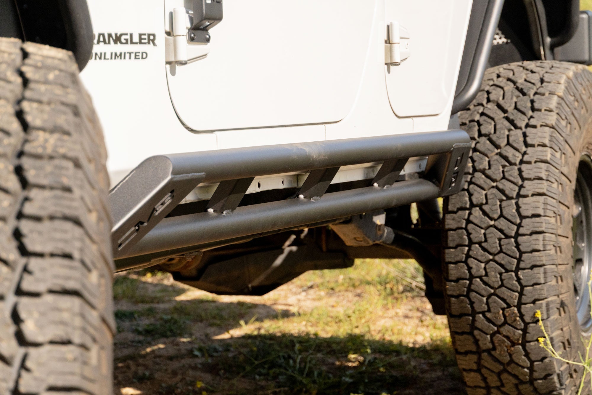 Jeep-Wrangler-JK-4-Door-Rock-Sliders-Installed-4 - NVMOS