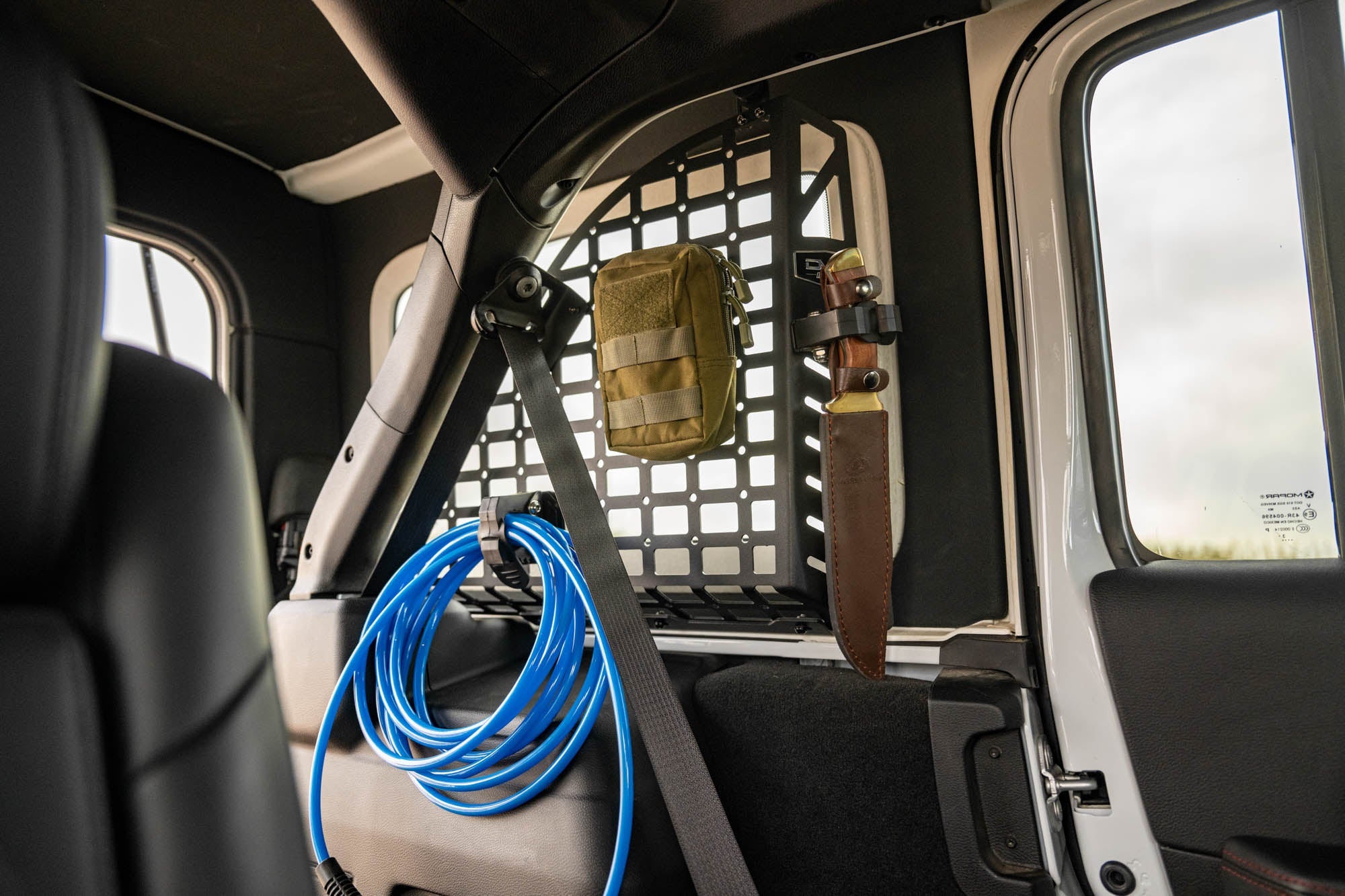 Jeep-Wrangler-JL-4-Door-Rear-Window-Pocketed-Molle-Panels-Installed-1 - NVMOS