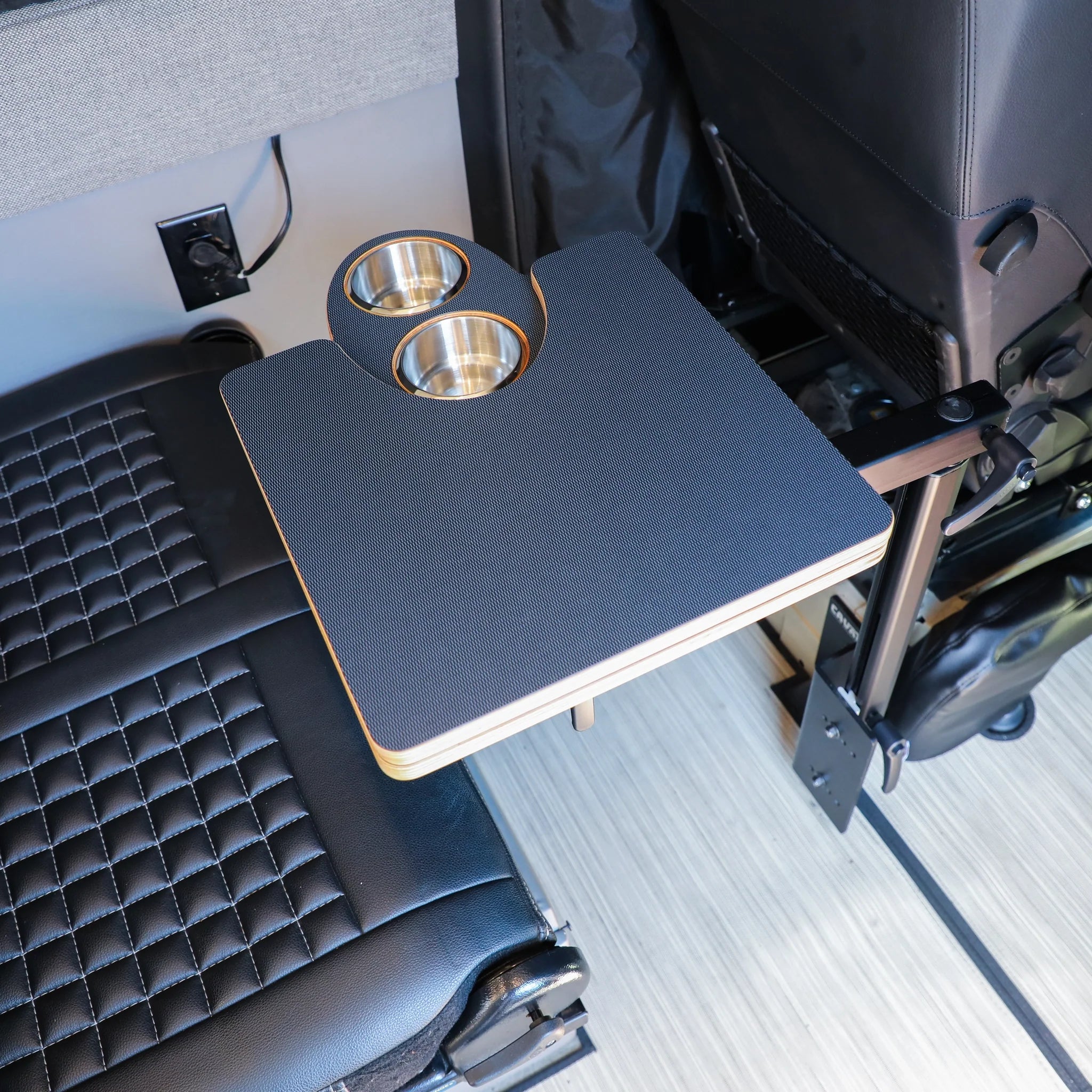 Vehicle seat-mounted camping table with two built-in cup holders, overlanding accessory