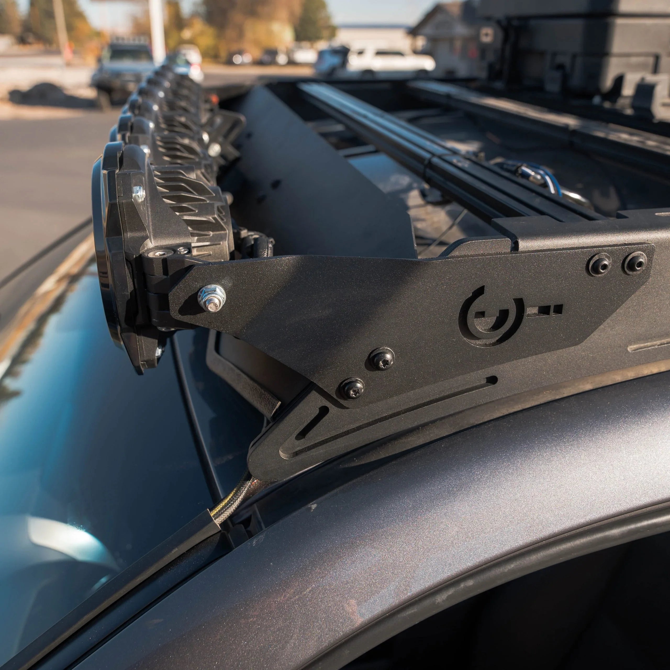 Close-up of overland roof rack and LED light bar mounted on adventure vehicle