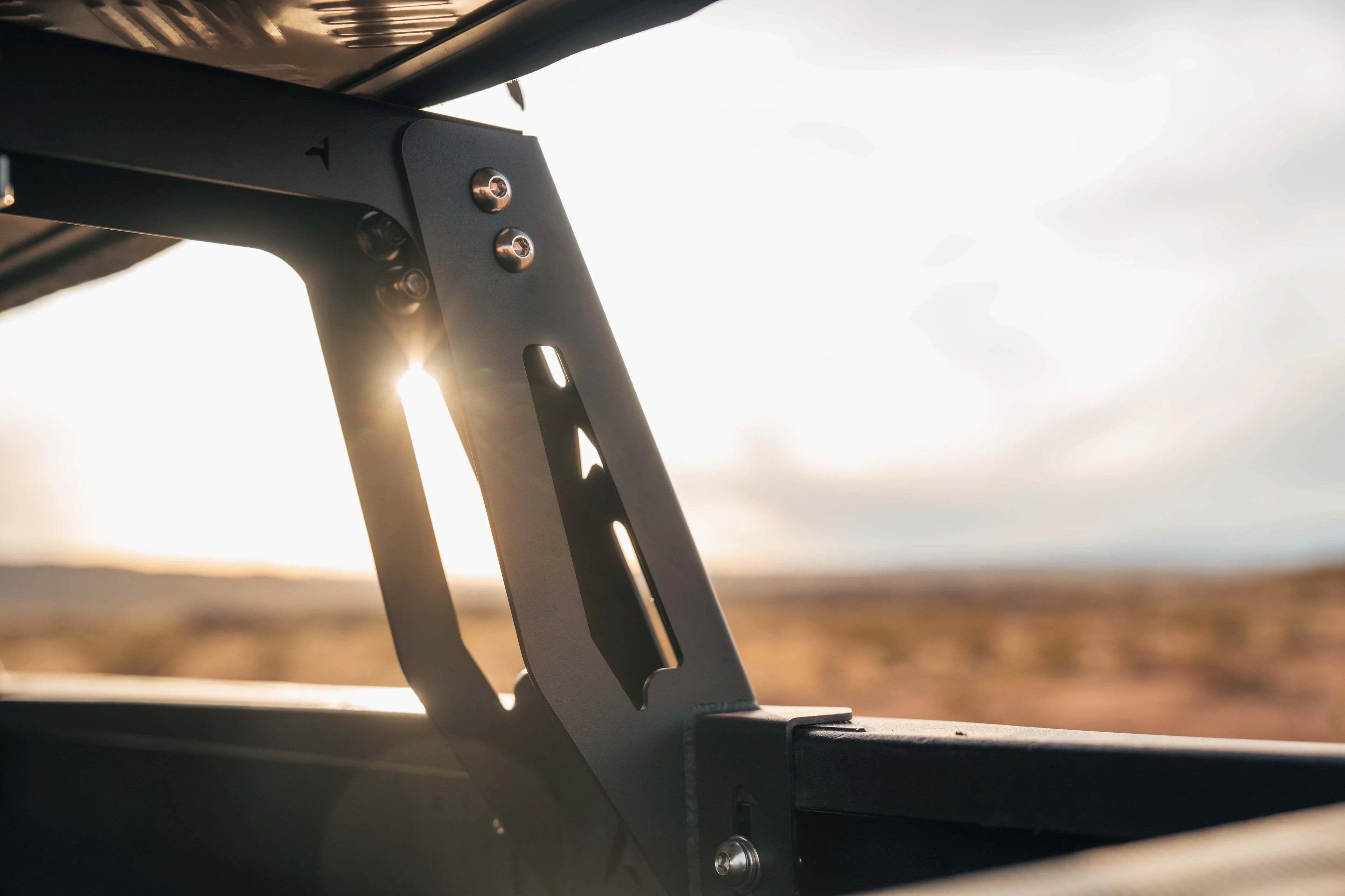 Close-up of overland bed rack mount on pickup truck at sunset, outdoor adventure gear