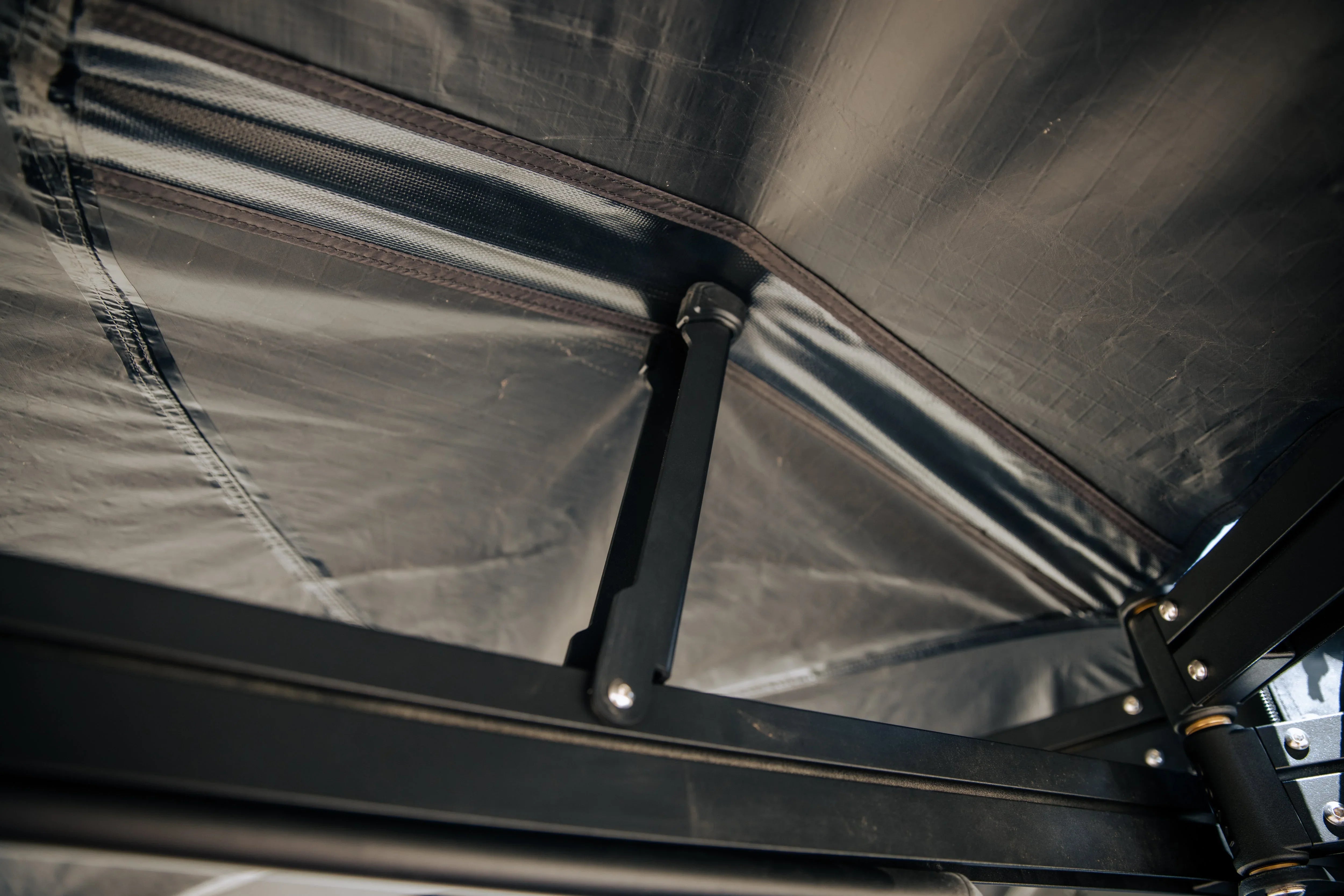 Close-up of overland roof top tent support frame and waterproof fabric seam