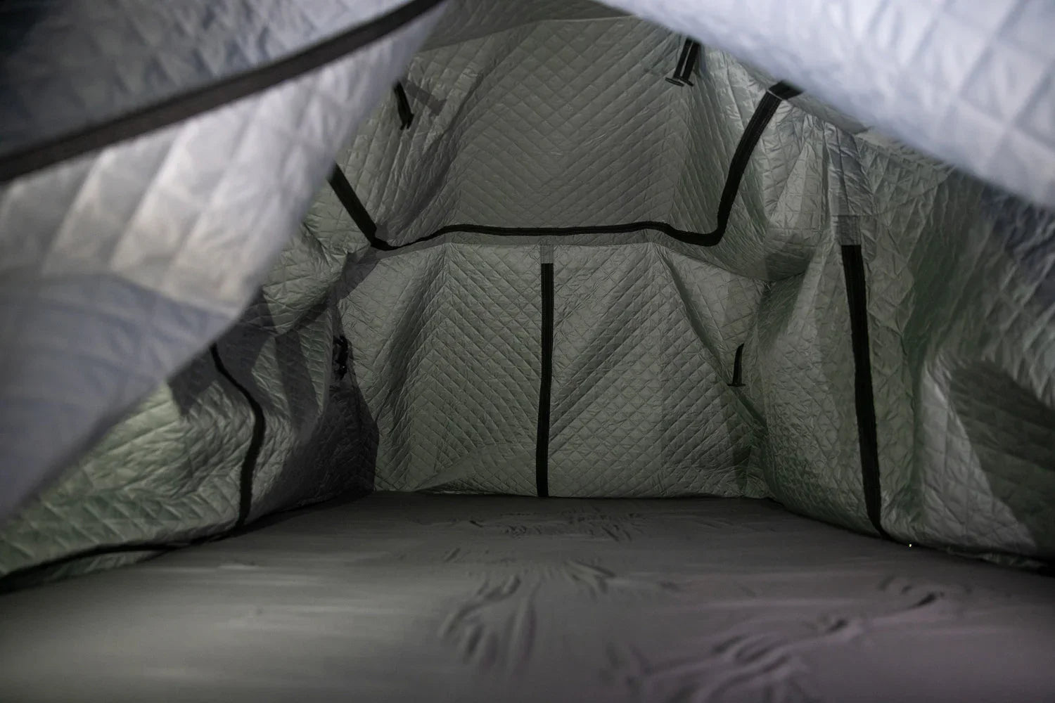 Interior of insulated quilted rooftop tent for overlanding and expedition camping
