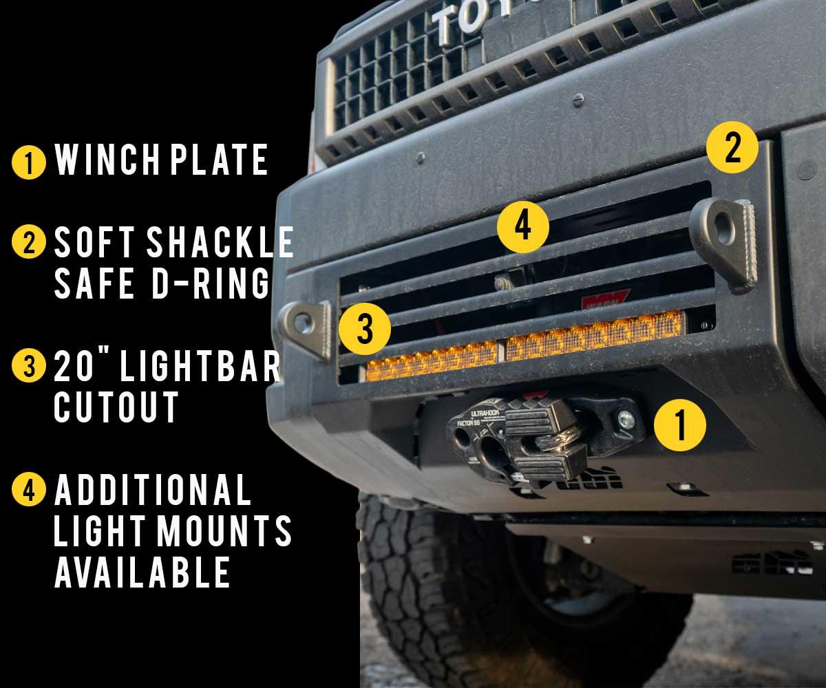 Toyota truck front bumper with winch plate, soft shackle D-ring, 20-inch lightbar cutout, and light mounts for overlanding.