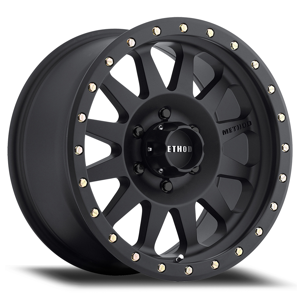 Matte black alloy off-road wheel with 12 spokes and silver bolt accents for trucks and SUVs