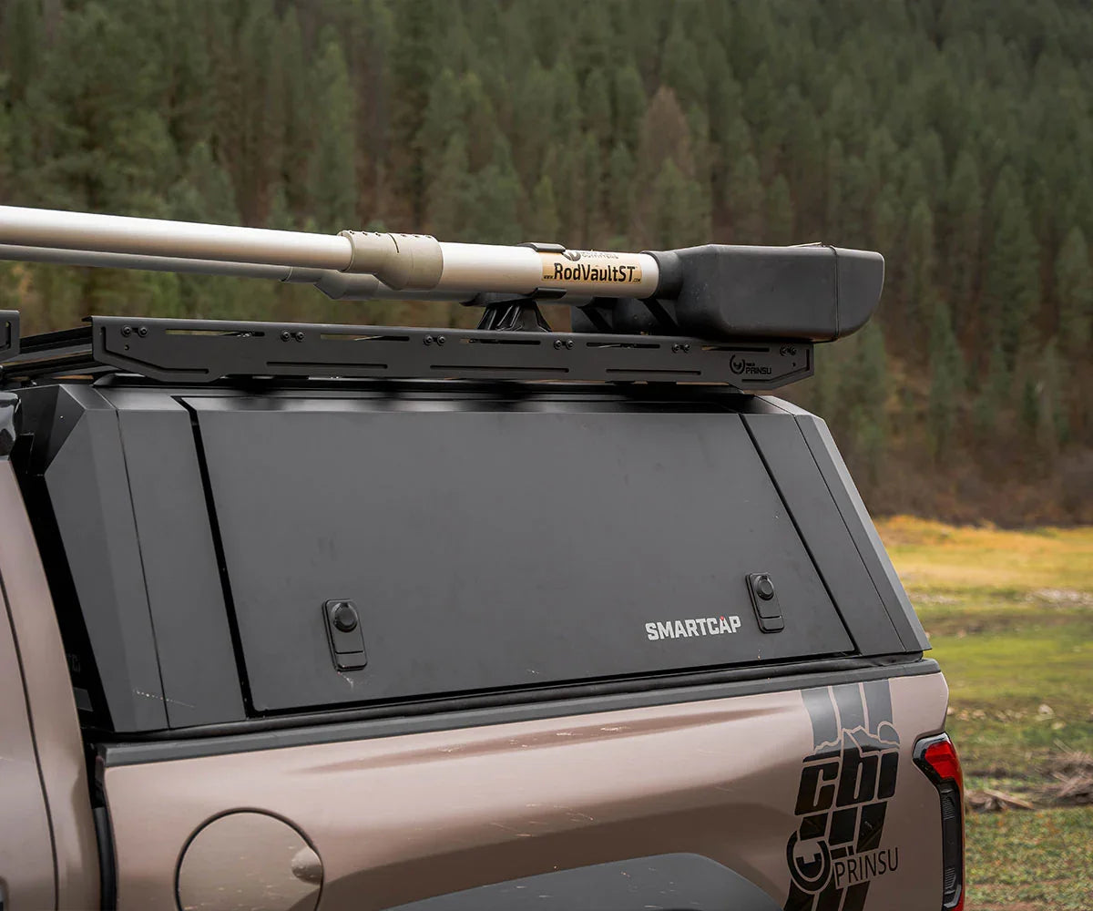 Overland truck with Prinsu roof rack and RodVault gear case on SmartCap in outdoor setting