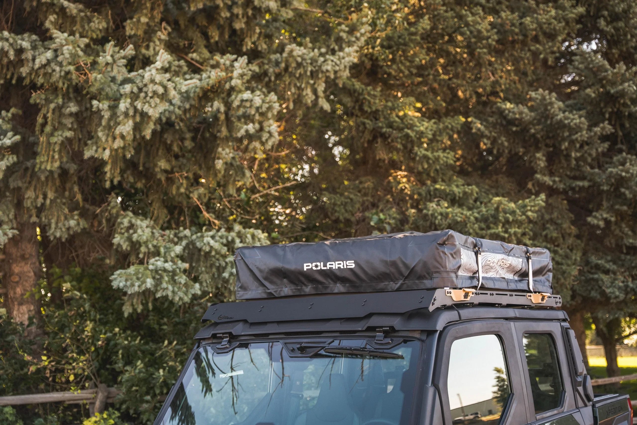 Polaris roof top tent mounted on off-road vehicle for overlanding and camping