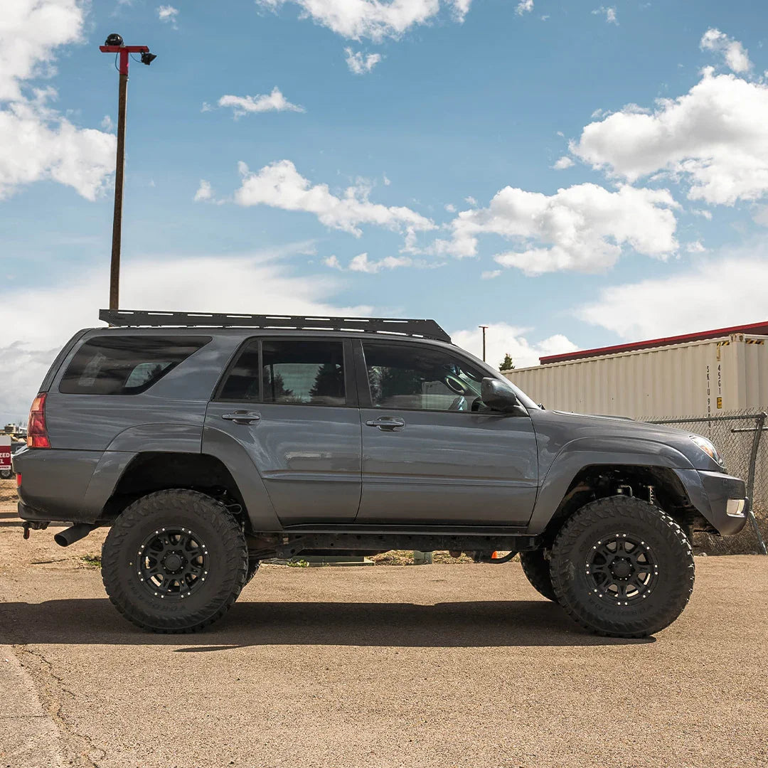 Toyota 4Runner with full roof rack and off-road tires parked outdoors