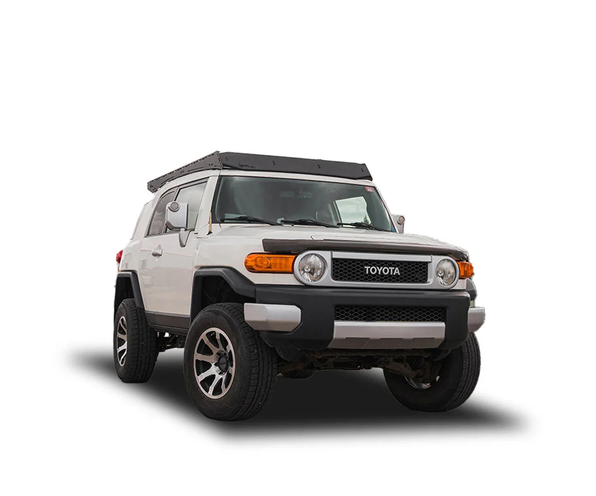Toyota FJ Cruiser with Prinsu Pro roof rack, off-road wheels, white background