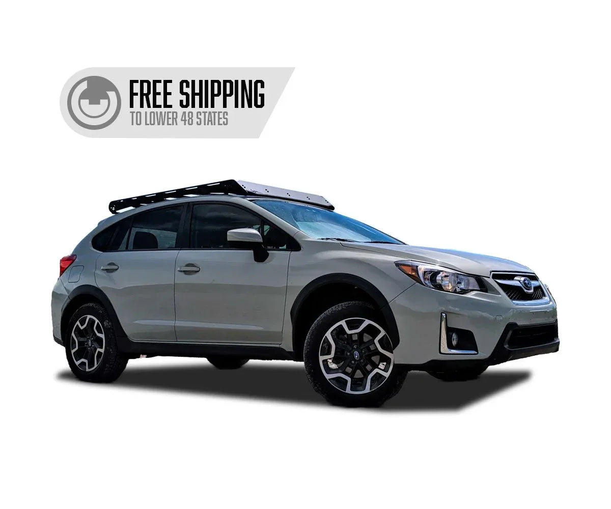 Roof rack installed on silver Subaru Crosstrek overland vehicle, side view, white background.