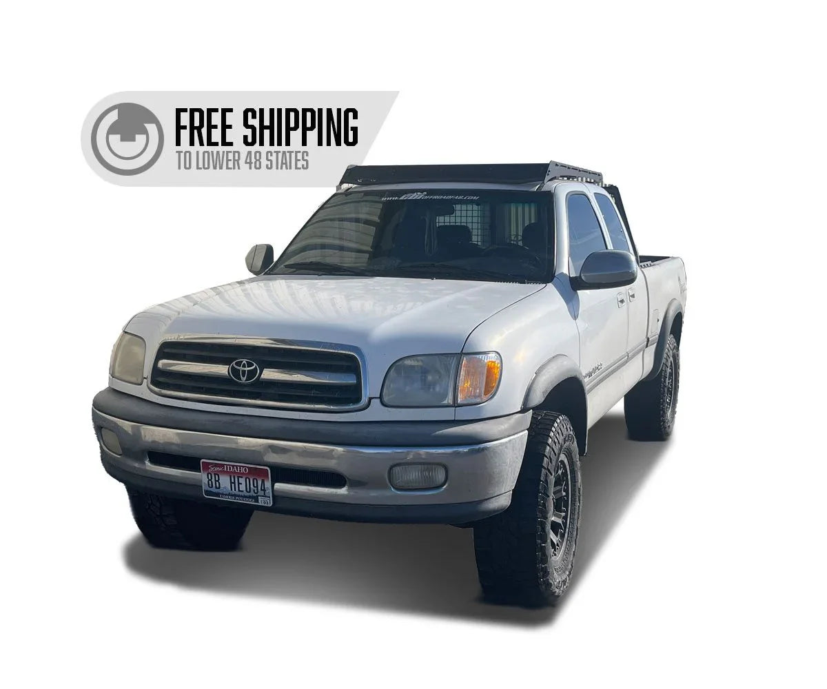 White first generation Toyota Tundra pickup with roof rack for overlanding
