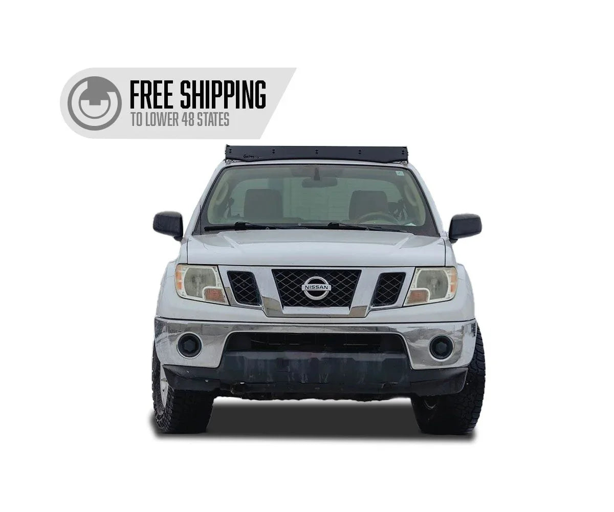Nissan Frontier with aftermarket roof rack, front view, overlanding vehicle accessory