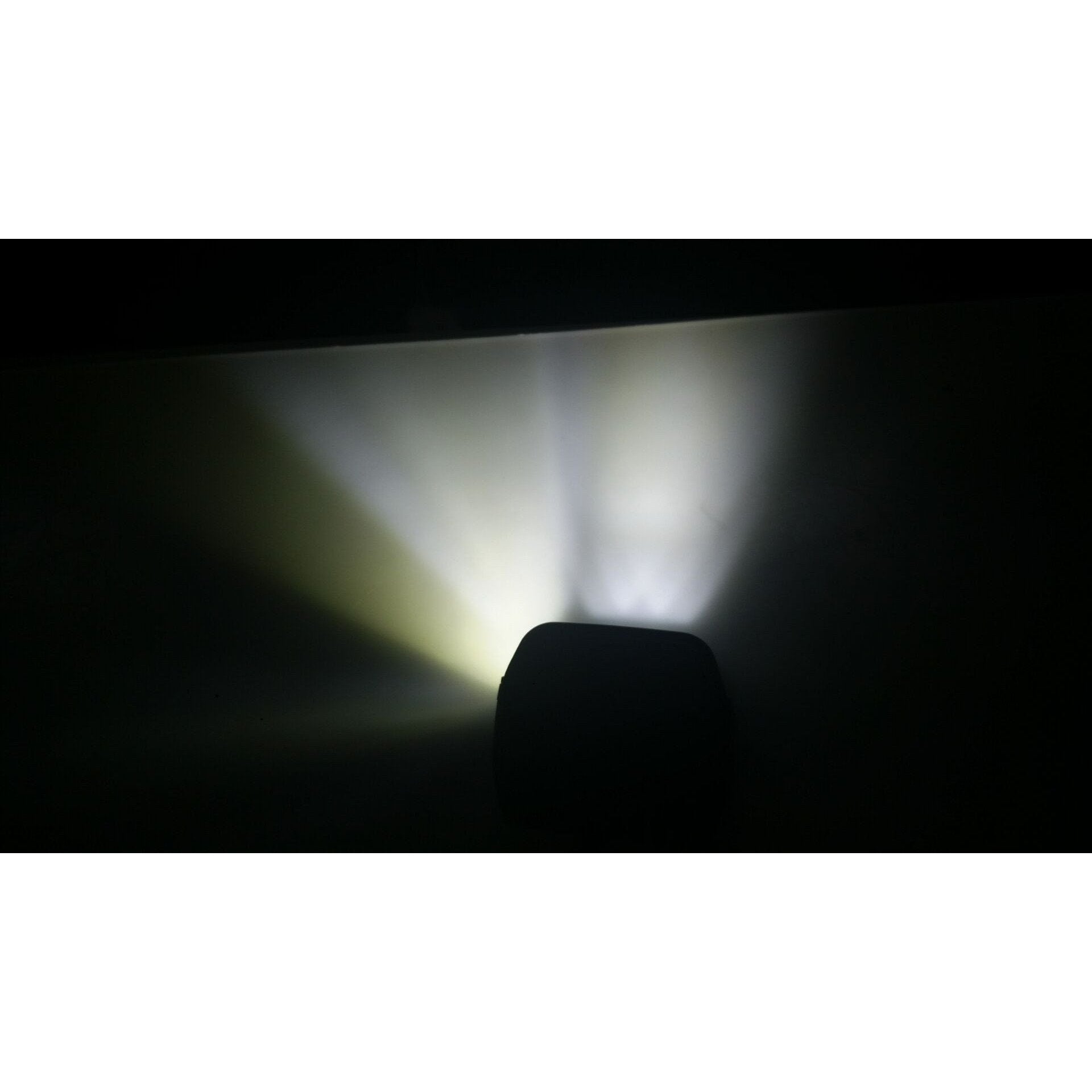 Off-road LED light casting bright beams, ideal for camping and overlanding vehicles