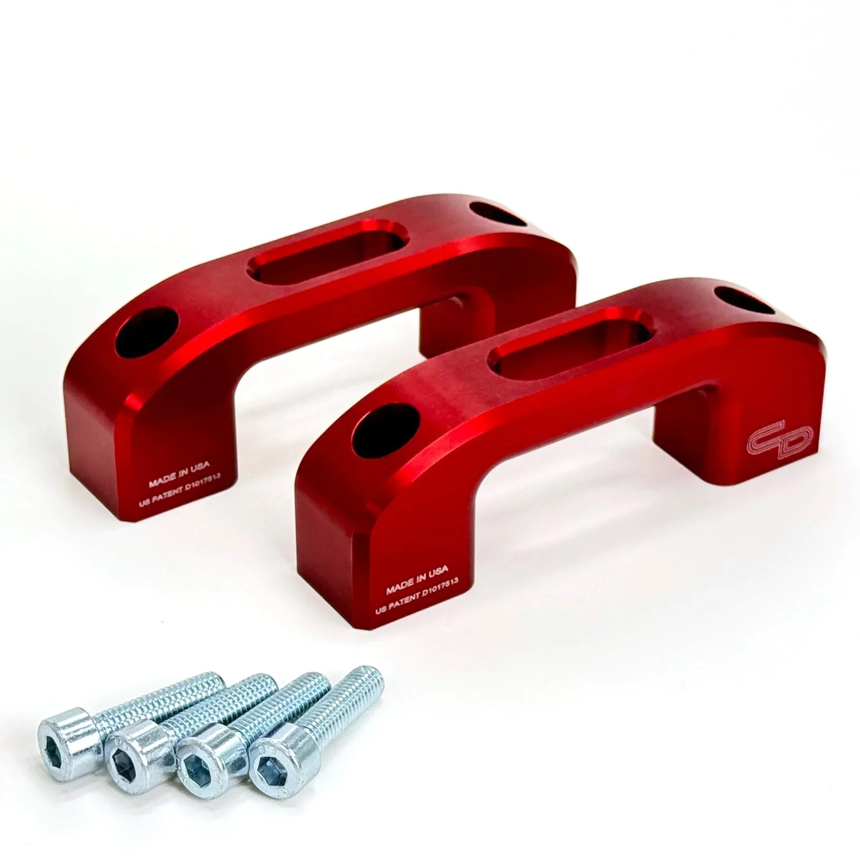 Pair of red anodized aluminum tie down anchors with mounting bolts for truck bed