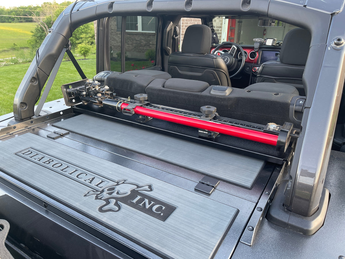 Diabolical Inc Slipstream Rail Rack with a Hi-Lift jack mounted