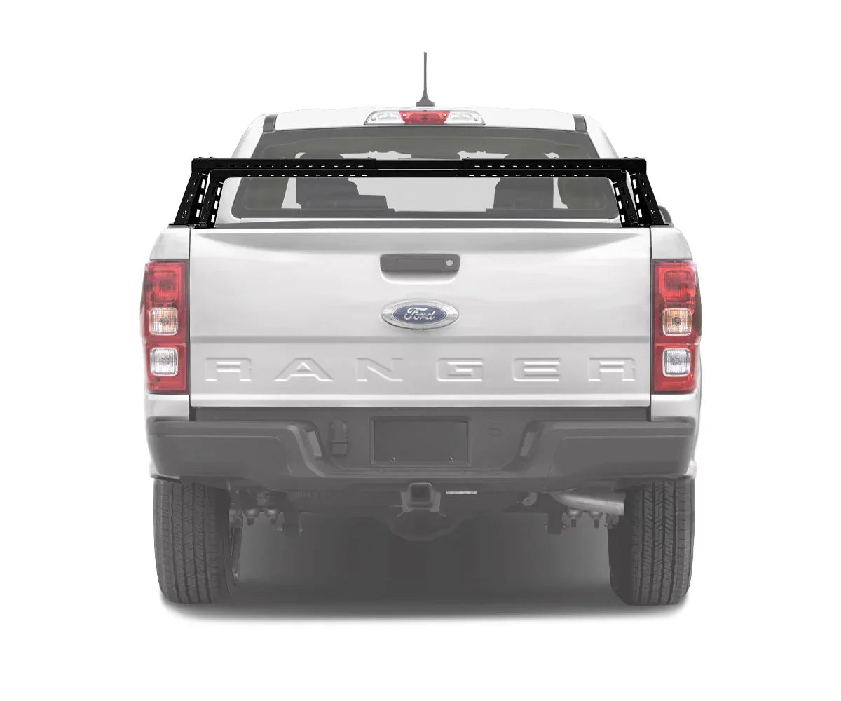Rear view of Ford Ranger pickup with black overlanding bed rack installed on truck bed