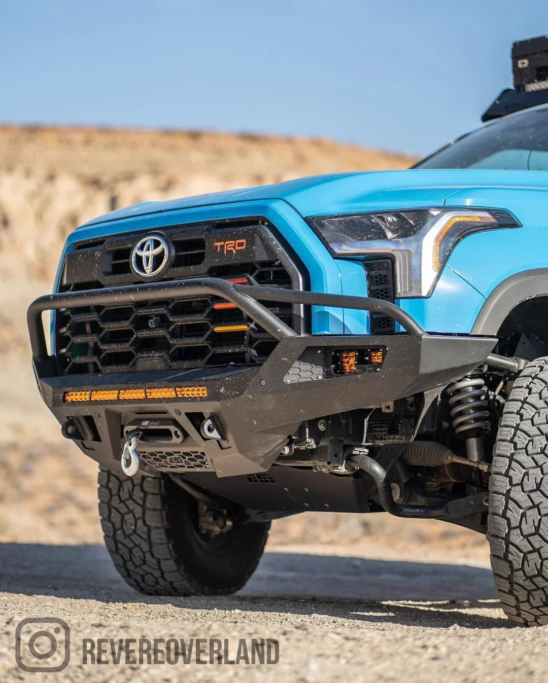 2022 Toyota Tundra with CBI off-road front bumper, rugged tires, desert background