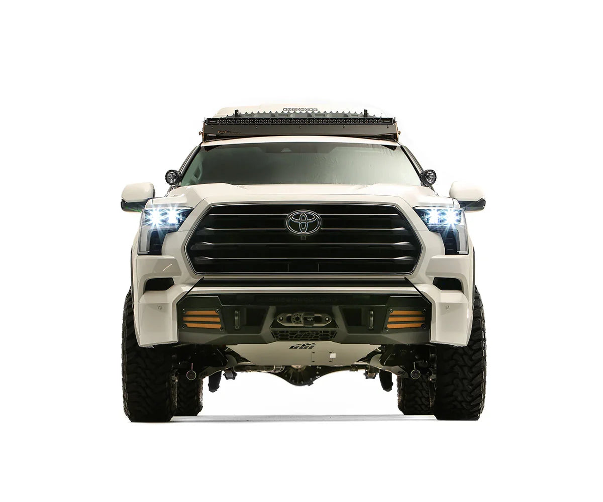 Front view of a white Toyota Sequoia with off-road accessories and LED lights